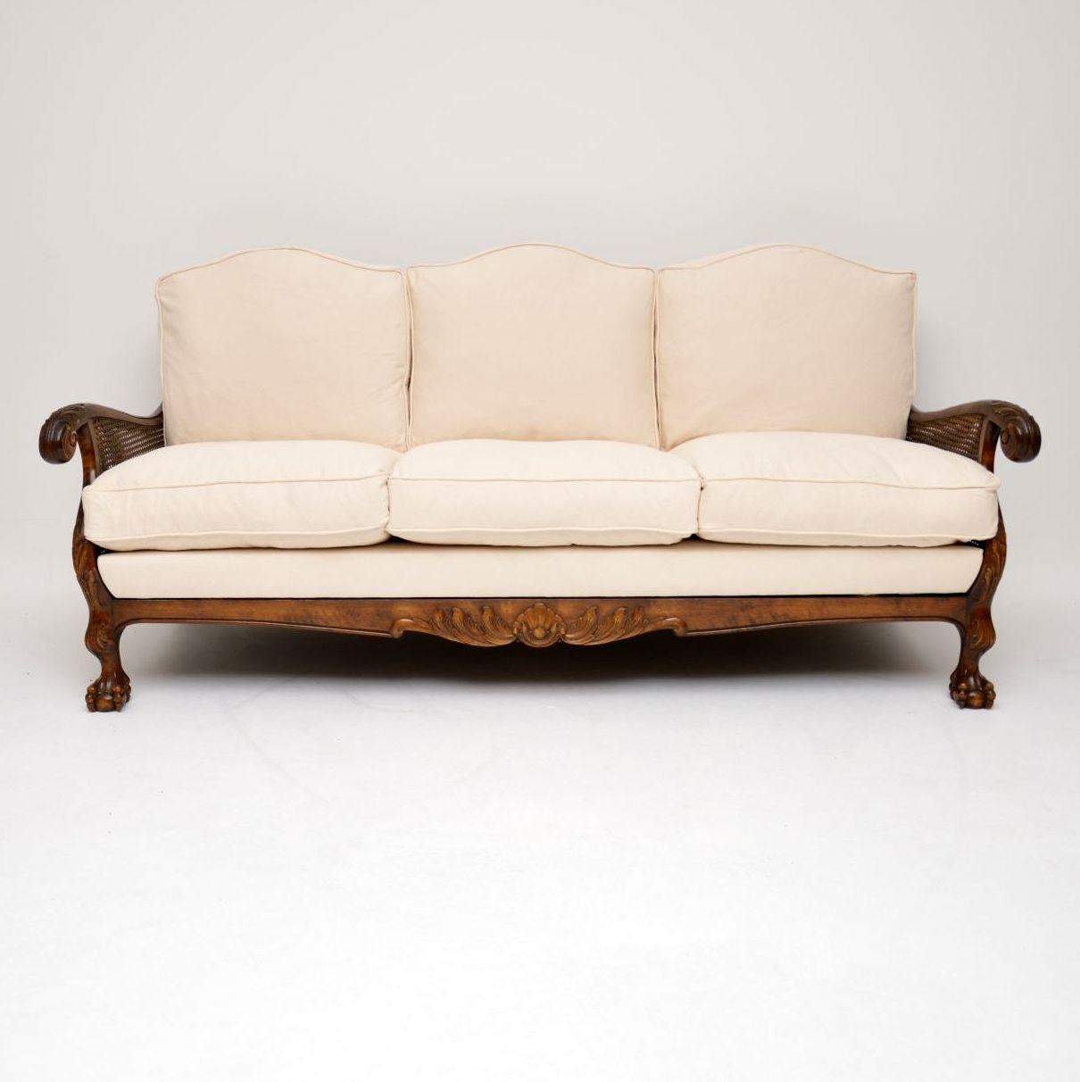 This antique Swedish Bergere three-seat sofa is satin birch and has just been completely re-upholstered in a neutral coloured fabric with new feather cushions. Consequently, it’s very comfortable, because the cushions are generously filled. The
