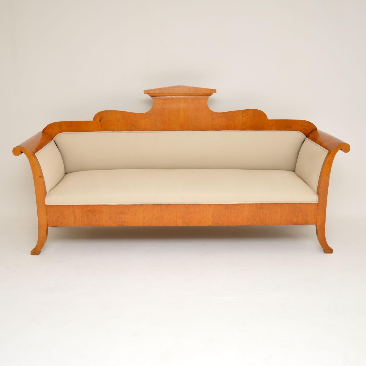 Large impressive antique Satin Birch Biedermeier sofa, which has just been re-upholstered in our regular natural cotton fabric. I would date it to circa 1850s period and it’s in excellent condition throughout.

This sofa has just come over from
