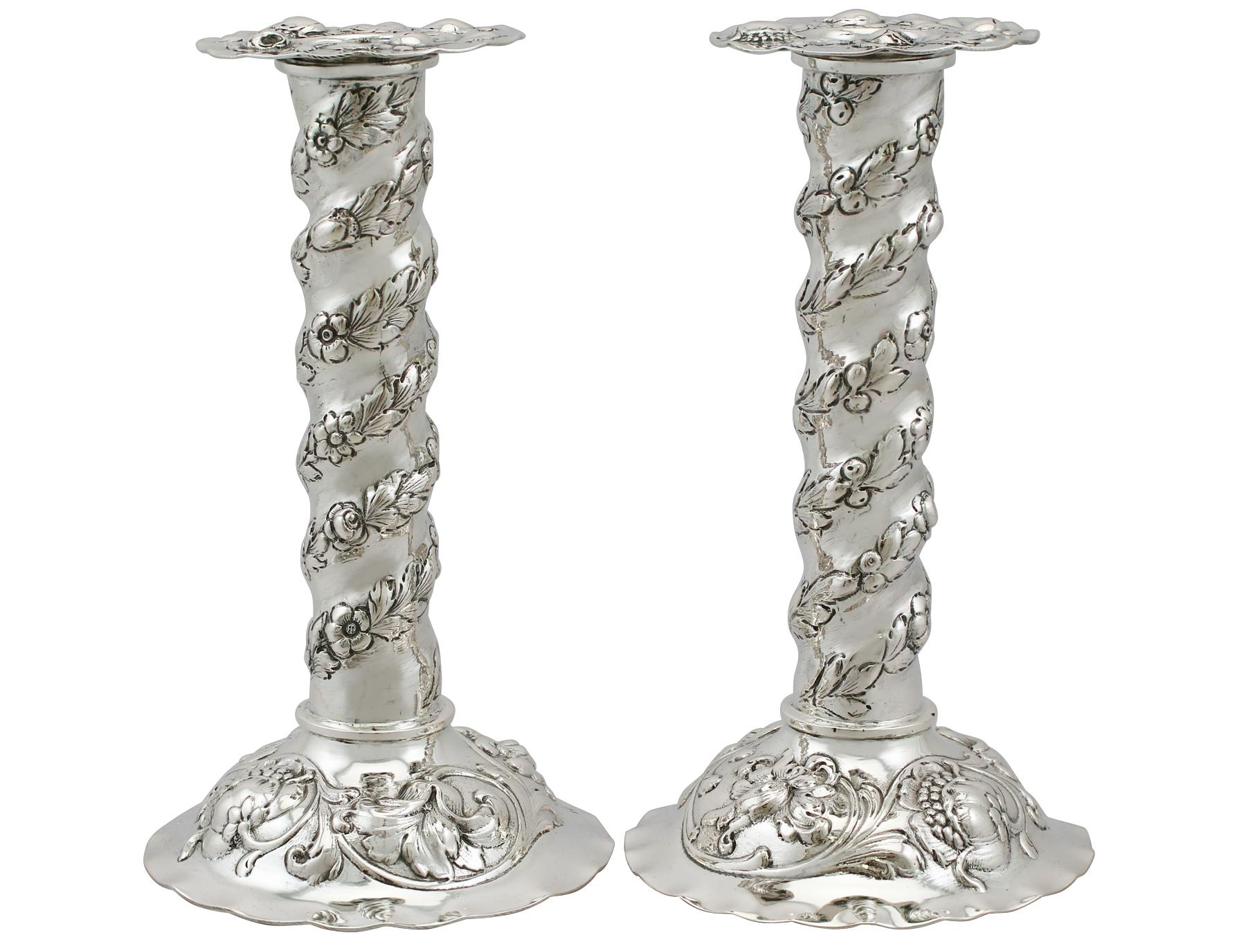An exceptional, fine and impressive pair of antique Swedish silver candlesticks; an addition to our ornamental silverware collection.

These exceptional antique silver candlesticks have a cylindrical shaped form onto a circular domed base.

The