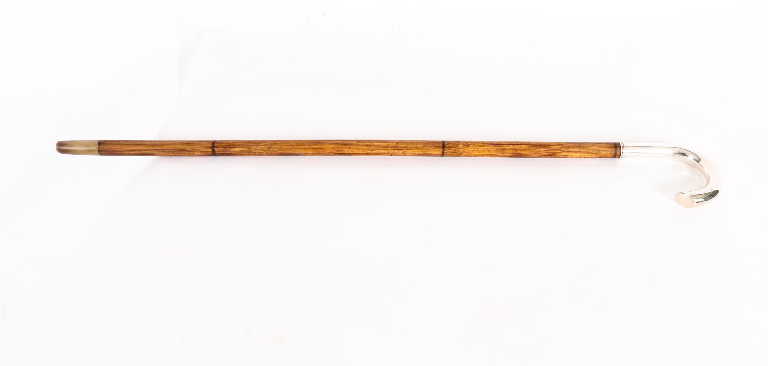 A  handsome substantial  Swedish silver handled walking cane with impressed hallmarks and makers mark S. P. H and the date mark for 1915.

The silver crook shaped handle on a sturdy bamboo tapering shaft with its original  ferrule.

It is a lovely