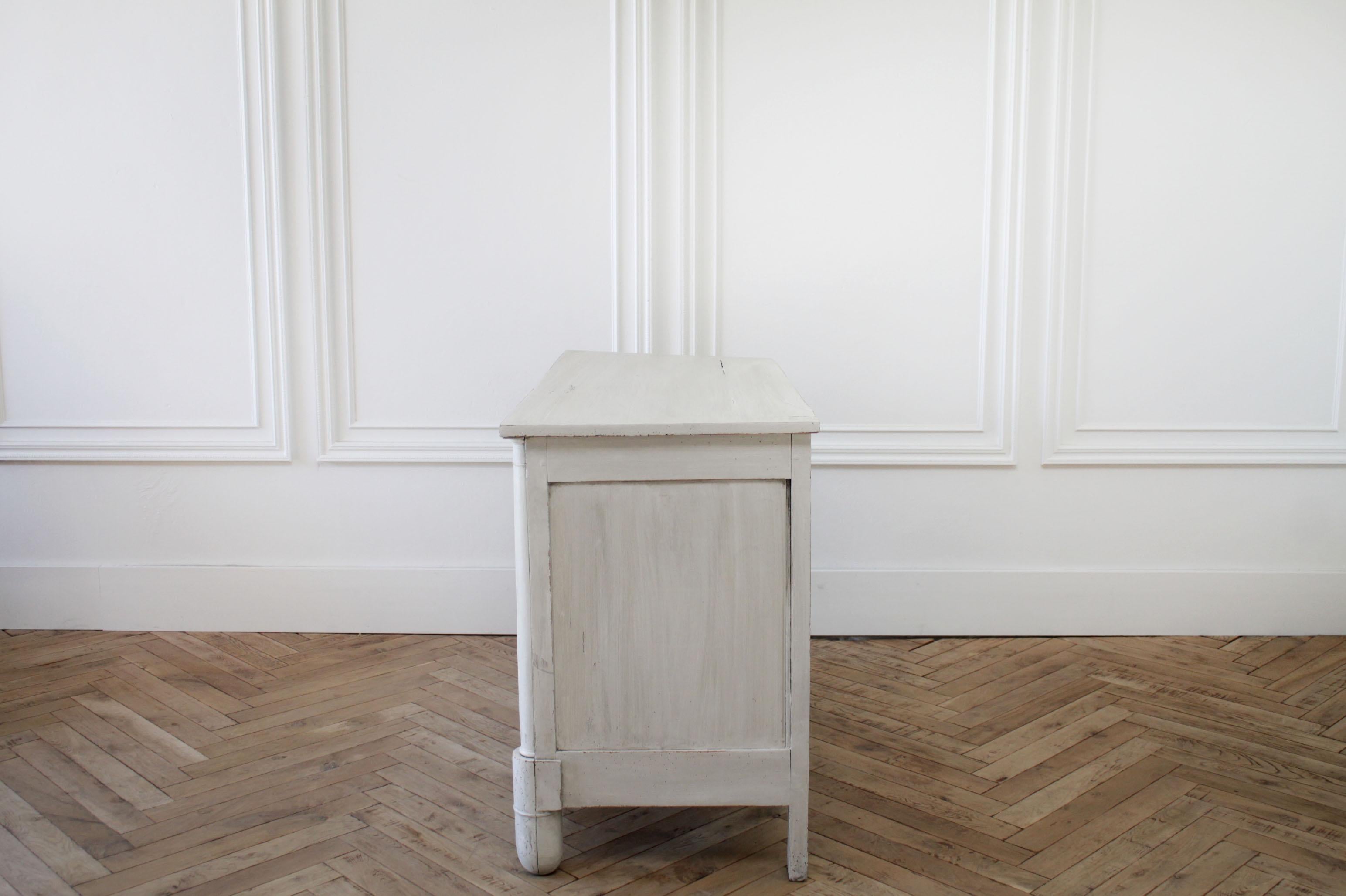 Antique Swedish style commode or chest of drawers
Painted in our antique white with subtle distressed edges, and antique patina finish. The brass hardware has a rubbed paint finish. 3 working drawers with a dovetail finish open and close with