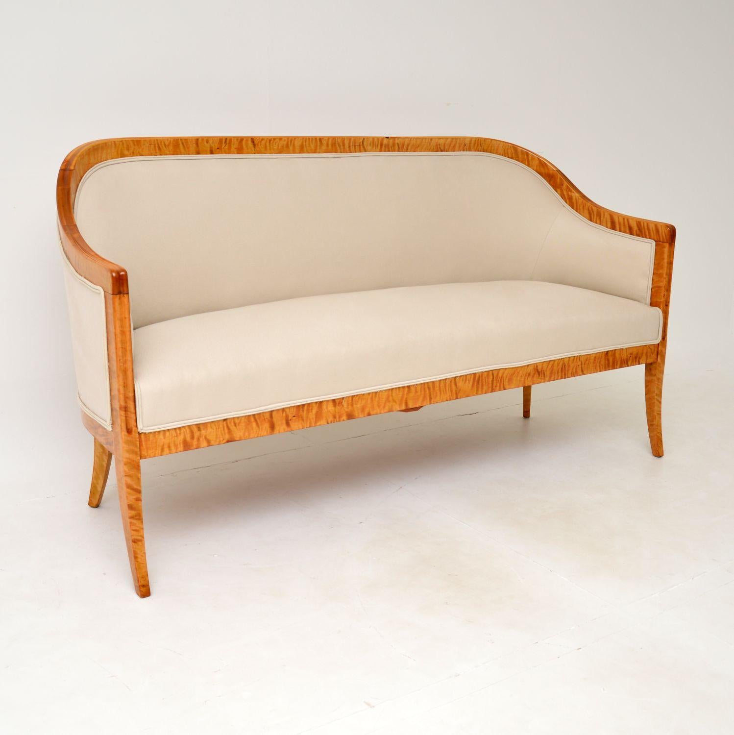 A stunning antique Swedish sofa from the Biedermeier period, which I would date from around the 1840-1860’s period.
It is beautifully made from tiger birch wood, which has a gorgeous colour and striking grain patterns. The quality is amazing, the