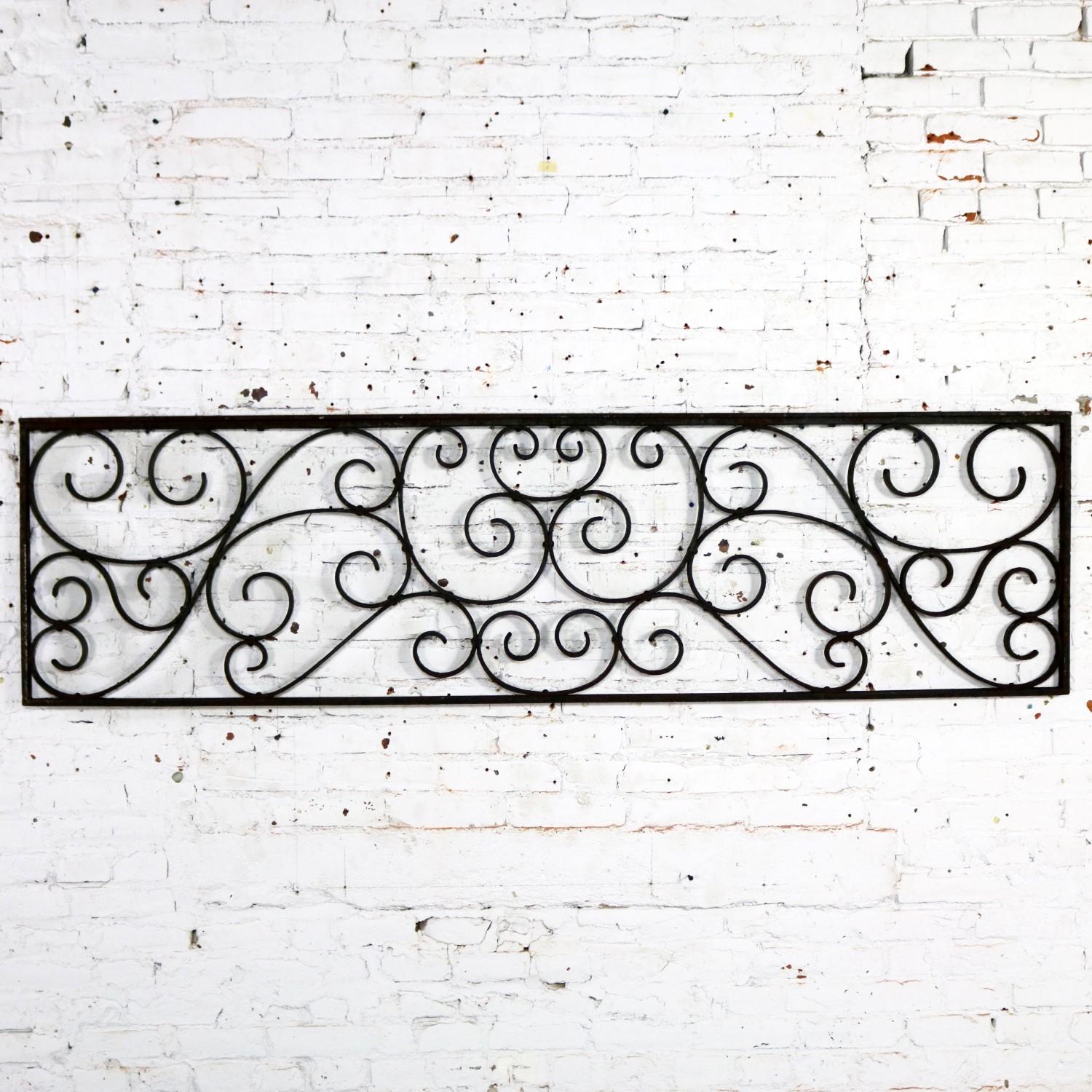 Gorgeous antique swirled design piece of wrought iron. It is, and was originally, a railing piece but could be used as a fence section, a trellis or wall-hanging art piece. It is in wonderful antique condition with lots of age patina, circa