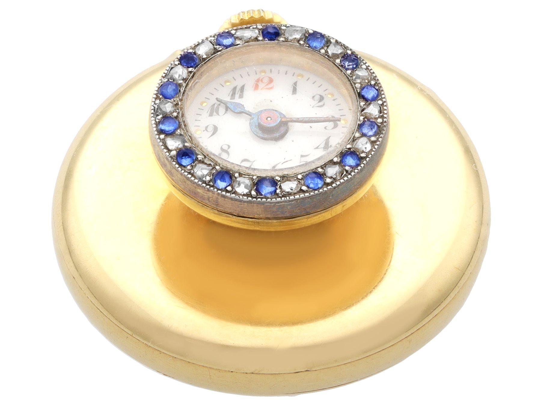 A fine and impressive antique Swiss 0.15 carat sapphire and 0.09 carat diamond, 18 karat yellow gold lapel watch; part of our diverse antique jewelry and estate jewelry collections

This fine and impressive antique lapel watch has been crafted in