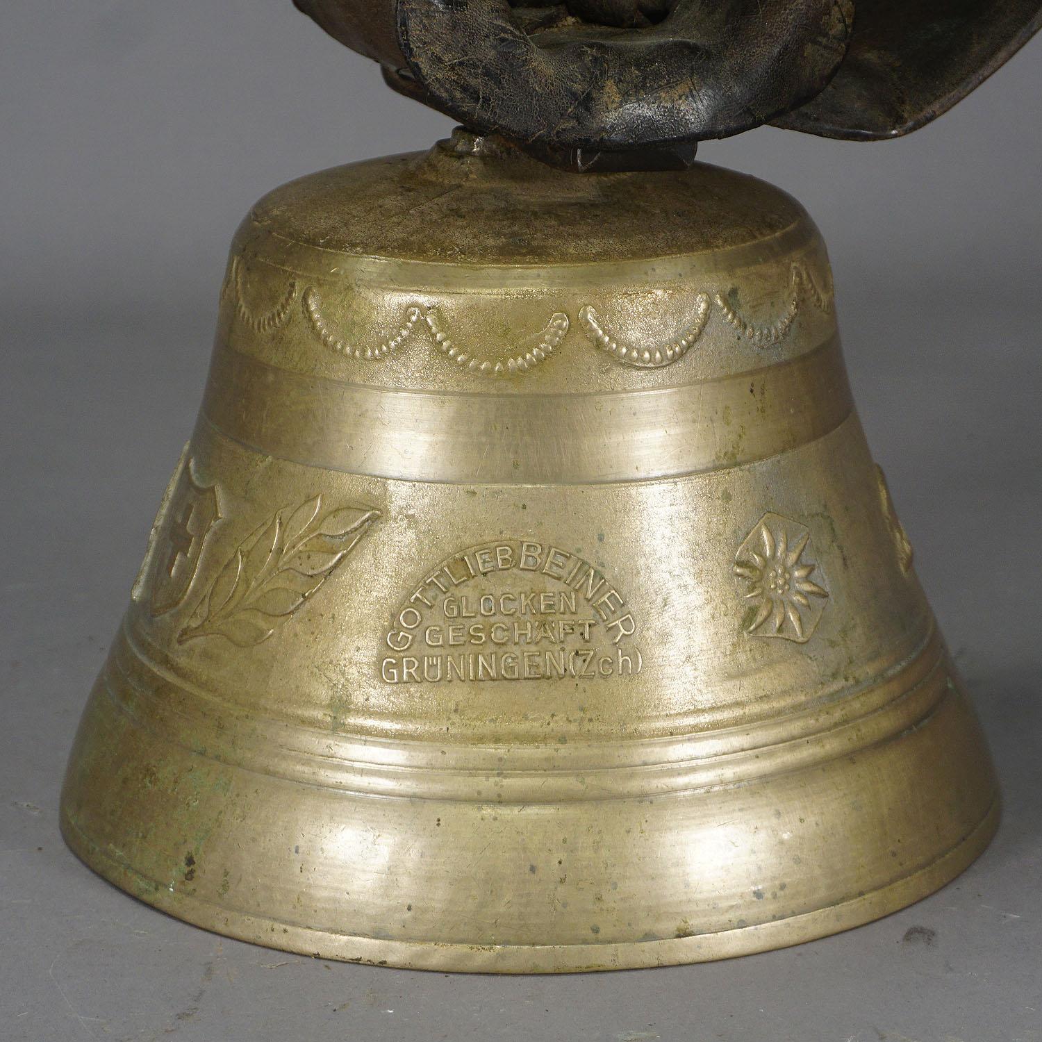 antique cow bell with leather strap