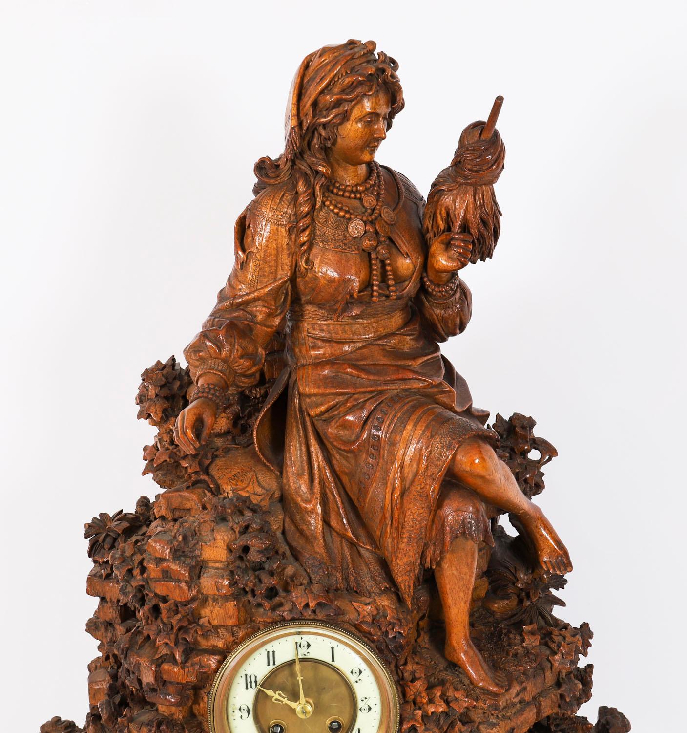 A large Swiss extremely finely carved museum quality linden wood table top clock by C.V. Bergen, Interlaken, Swiss Circa 1890 in date.

The clock features a seated maiden wearing a traditional Swiss Dirndl on a naturalistic jagged edge mountain