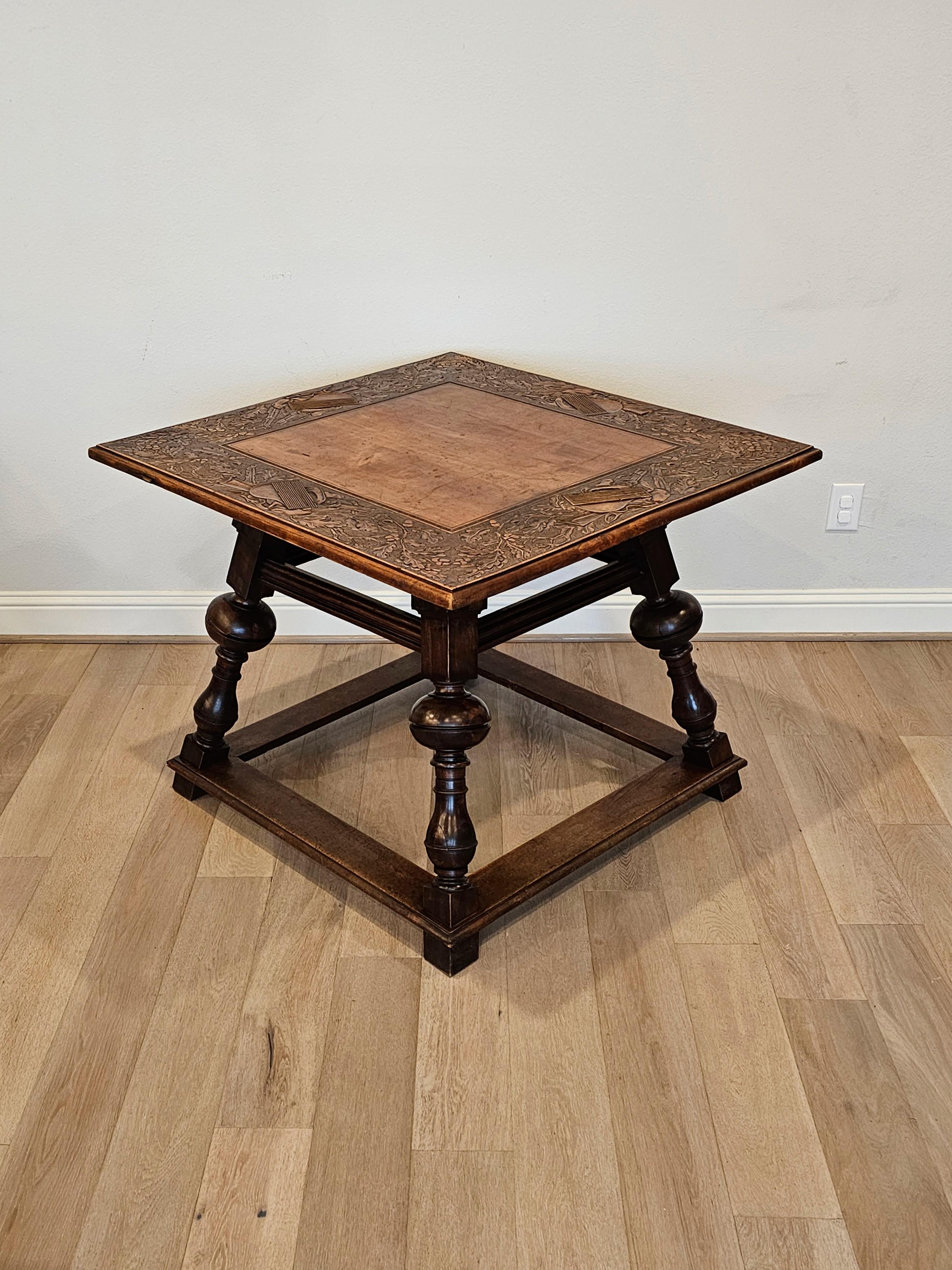 A scarce late 19th century Swiss Black Forest hand carved walnut table with nicely aged warm patina. 

Hand-crafted in Switzerland, circa 1880, the square tabletop features a relief carved border of oak branches, foliage and musical instruments,