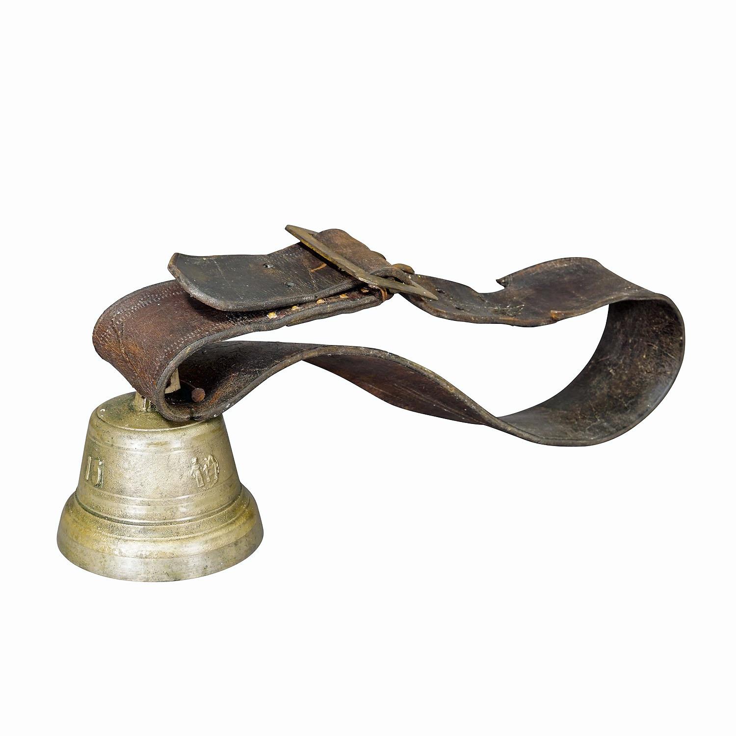 Antique Swiss Casted Bronze Cattle Bell ca. 1900s
Item e7313
An antique cast bronze cattle bell, made in Switzerland around 1900. The bell comes with its original brown leather strap with buckle. Bells like this are still used today to locate cows,