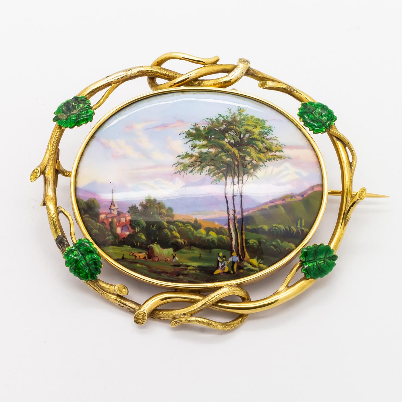 An antique Swiss enamel brooch, with an oval hand painted scene depicting mountains in the distance with a church surrounded by trees, with a feature tree, people and animals to the foreground, within a twisted 18ct gold frame with four green enamel