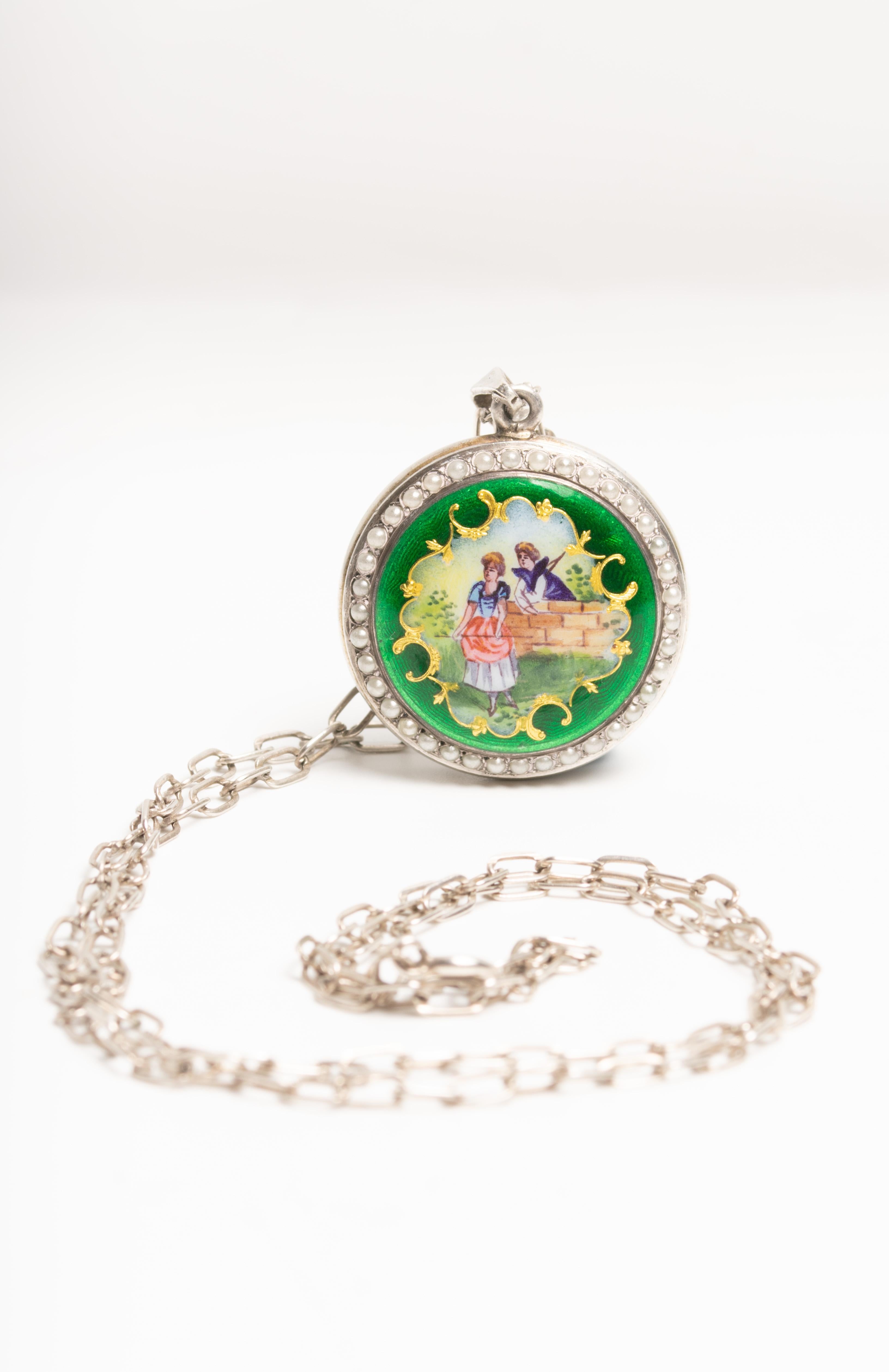 Exquisite Antique Swiss green guilloche enamel and silver locket. We believe the piece was a ladies pocket watch previously and converted to a locket later. This enamelled locket was made in Switzerland and it's decorated with a hand painted