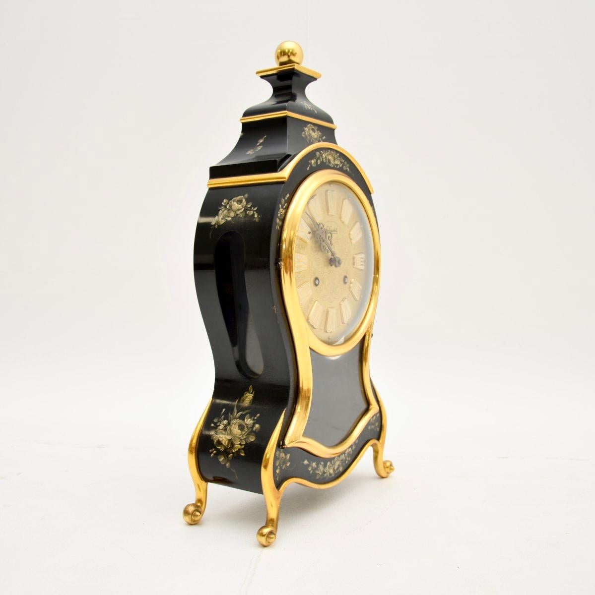A stunning antique Swiss hand painted wall clock by Le Castel, dating from around the mid twentieth century.

This is of incredibly fine quality, it is beautifully designed and hand painted. It is signed, comes with the winding key and also comes