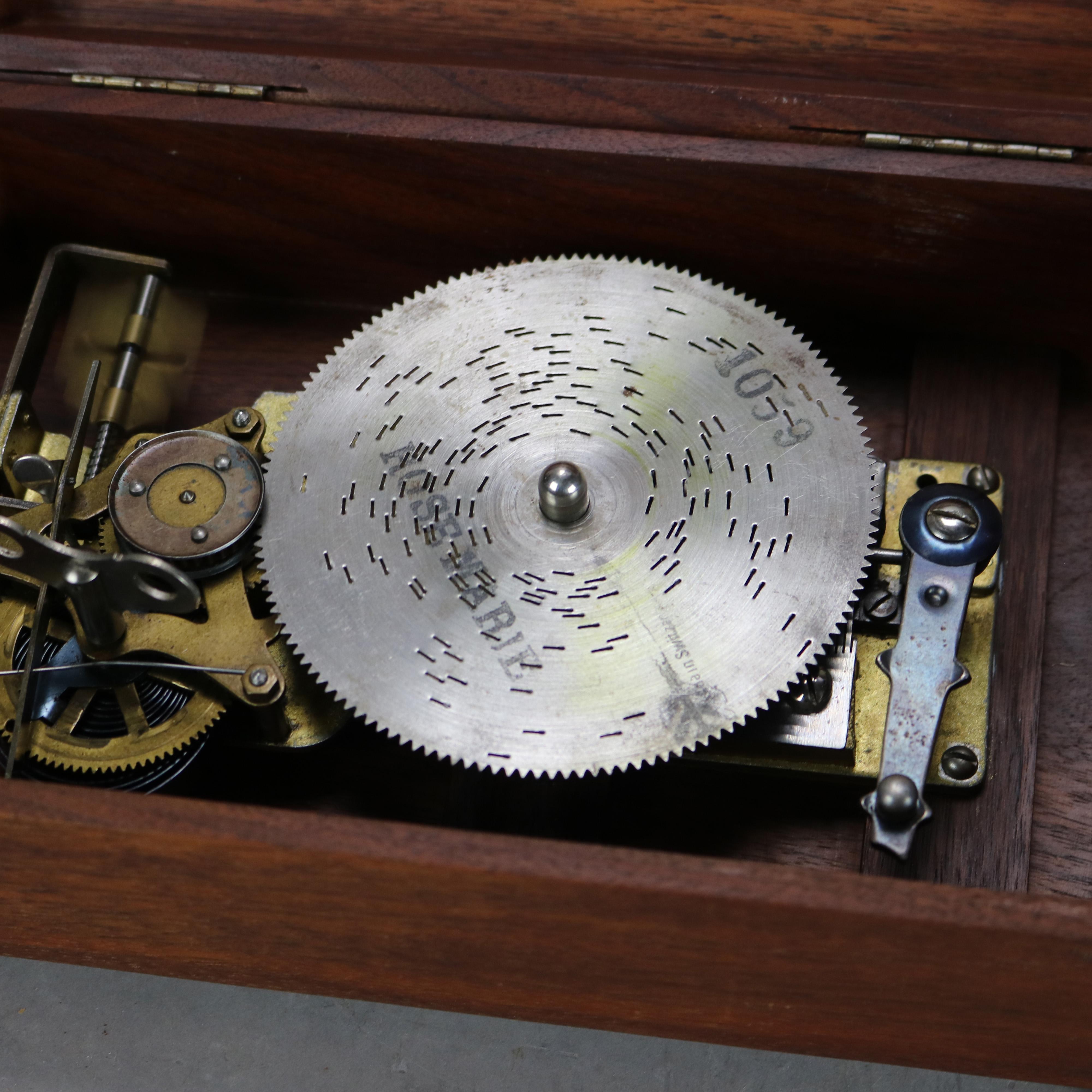 Antique Swiss Music Box with Eleven 4.5” Disks C1890

Measures- 6.25