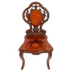 Silla antigua con incrustaciones de marquetería de nogal suizo S. XIX