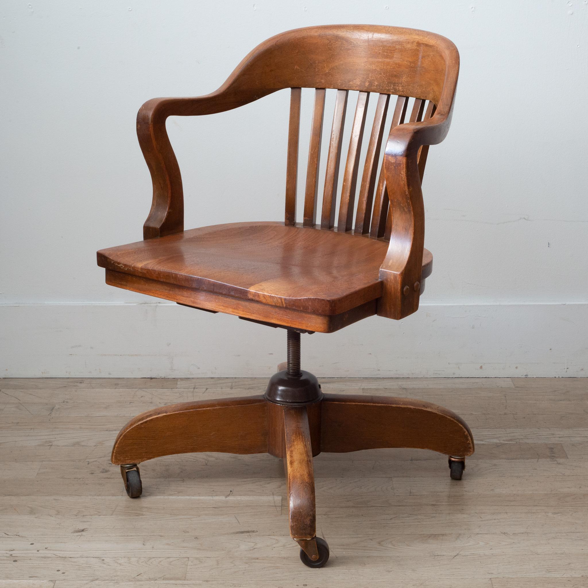 About

This is an original solid oak desk chair with brass casters. This chair swivels, tilts back and the height is adjustable. The chairs original cast iron mechanism was replaced sometime in it's life and functions well. This chair has retained