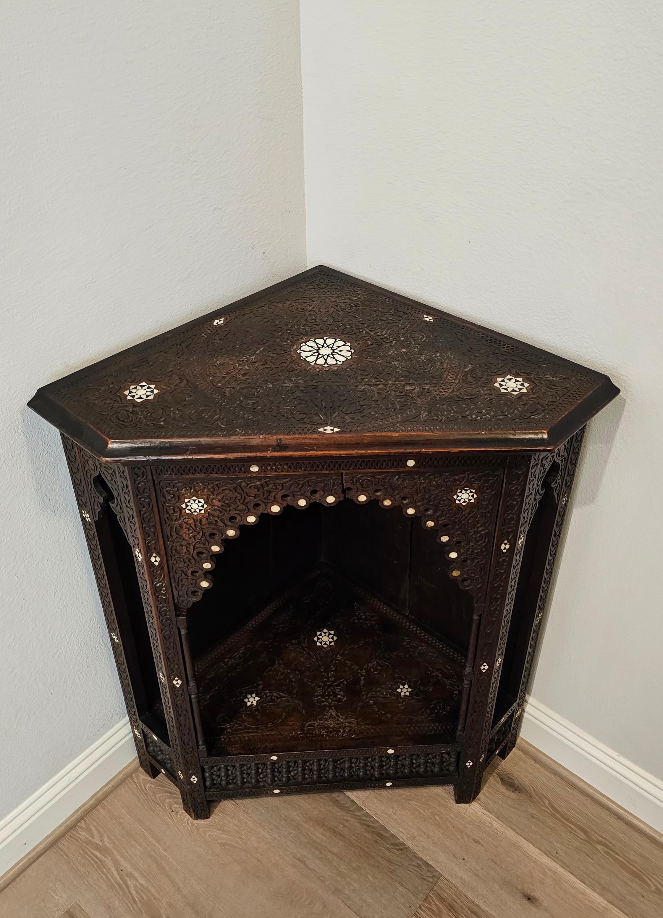 A scarce authentic antique circa 1890 Syrian corner cabinet / open display stand, elaborately decorated throughout, the amount of painstaking time and skill that was required is truly impressive!

Handcrafted in the Ottoman Empire / present day