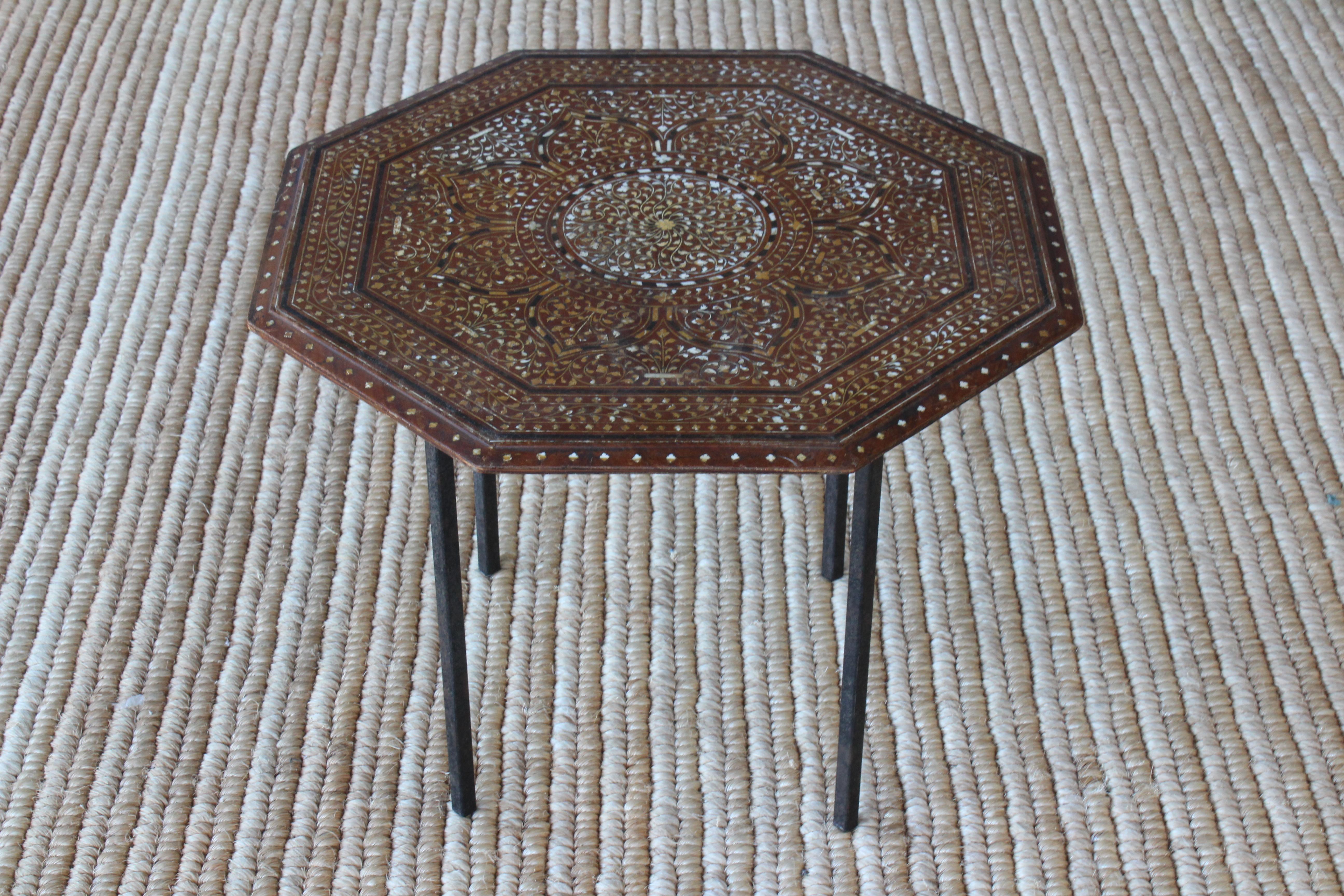 Antique inlaid side table on a custom-made metal base.