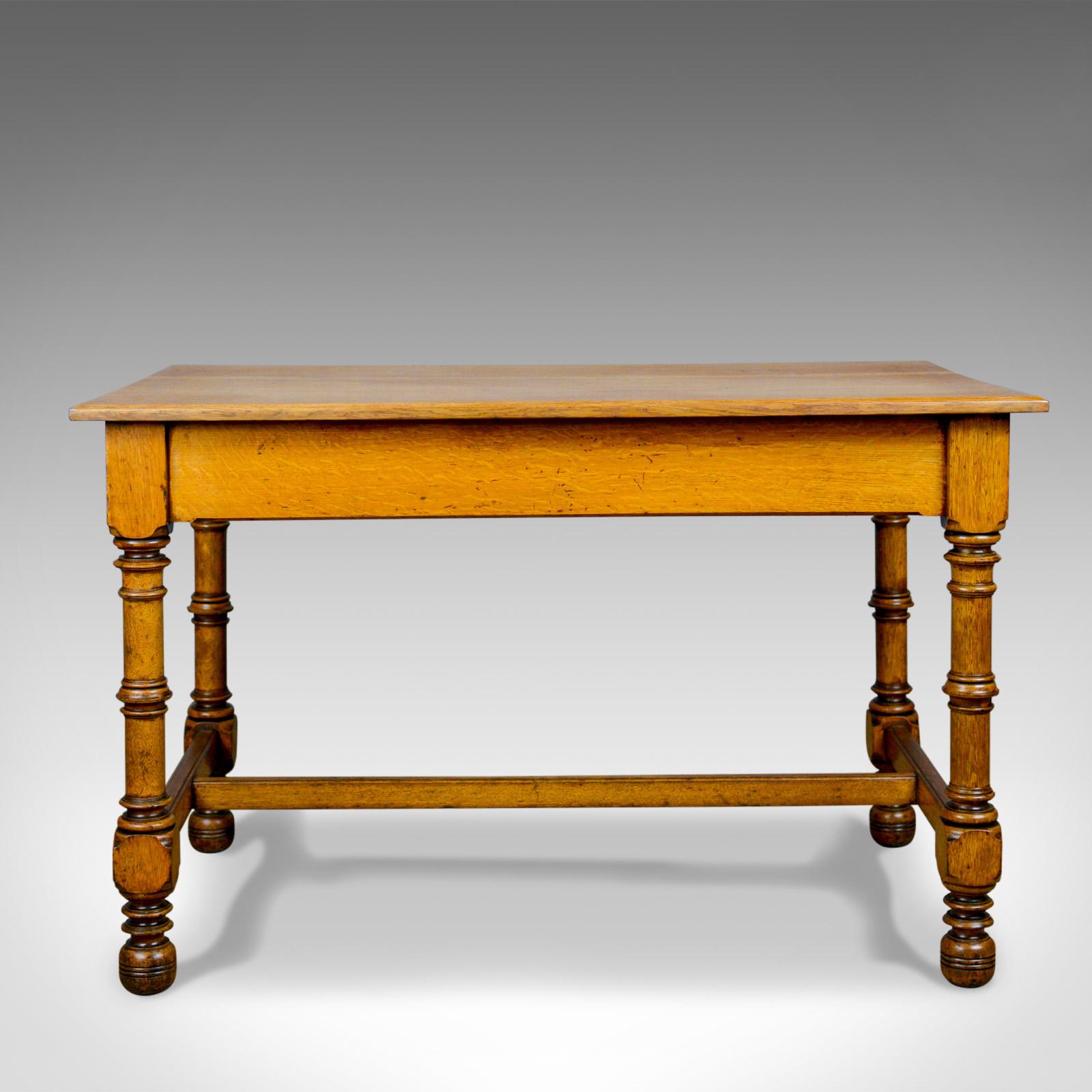 This is a Classic antique writing table, an English, Victorian side table in oak from the late 19th century, circa 1870.

Solid and stabile in strong English oak with a desirable aged patina
Honey hues with attractive grain detail in a waxed