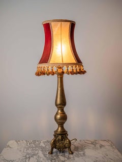 Antique table lamp on a baroque leg