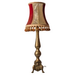 Antique table lamp on a baroque leg