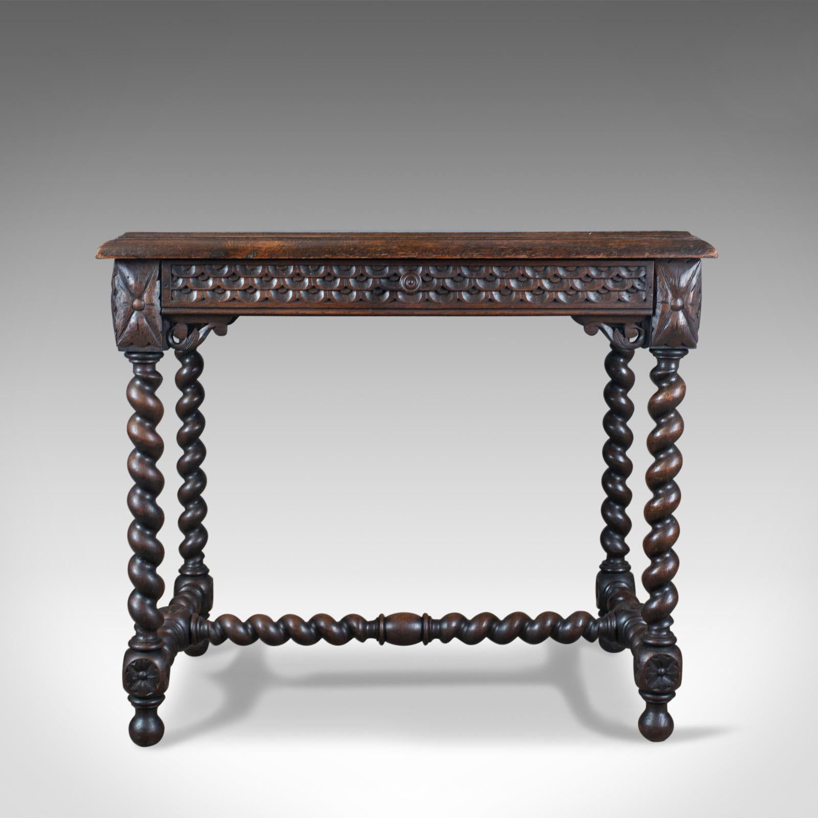 This is an antique table from the late 19th century. Scottish oak with carved decoration. Raised on barley twist legs, this side table dates to circa 1880.

A handsome side table displaying good colour and grain interest
The top displays well