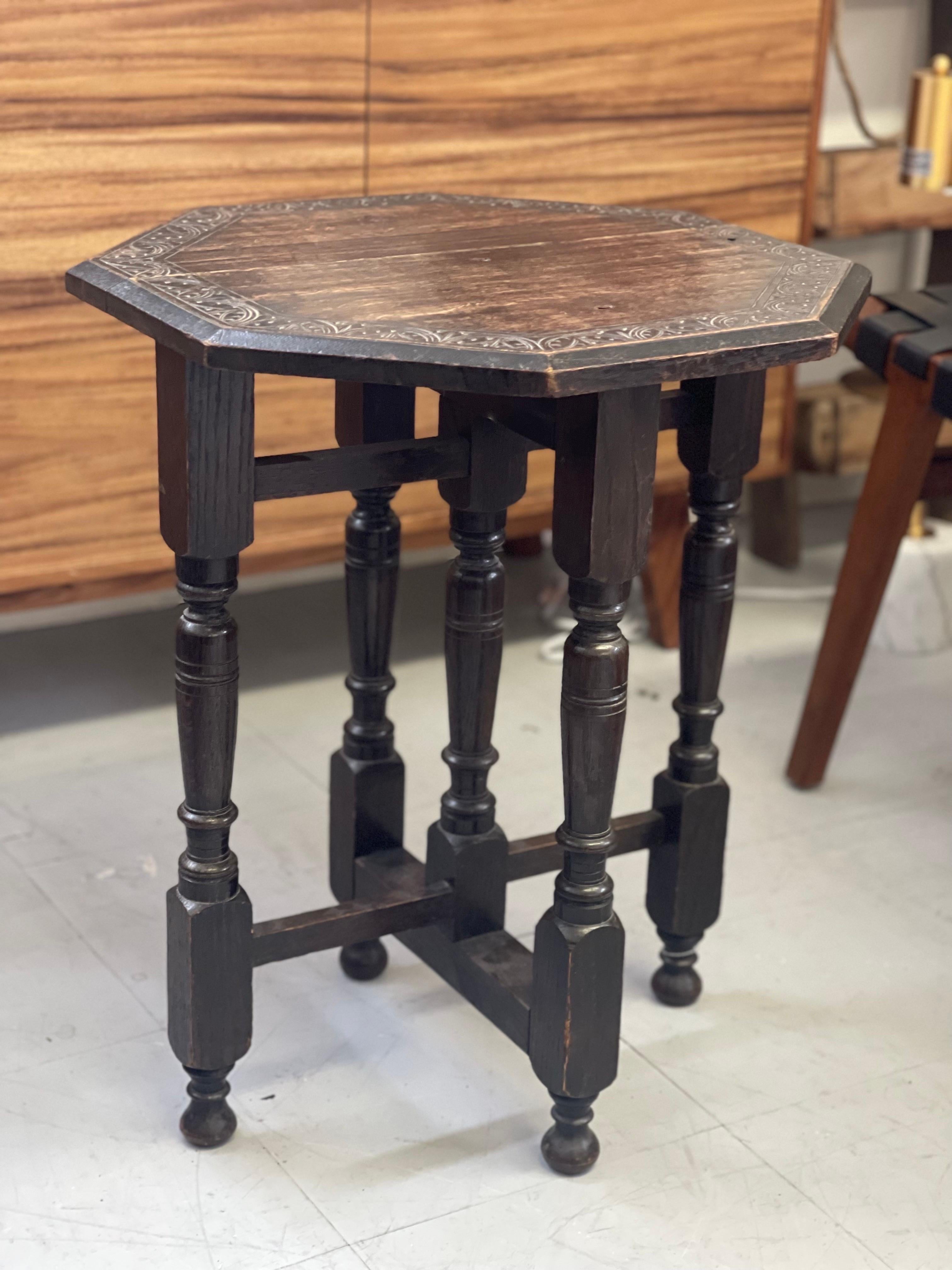 Antique table stand. Uk Import. This Table has Primitive Style and hand Carved Floral Design and has Great Character patina to the Wood.

Dimensions. 20 W ; 19 1/2 D, 24 H.