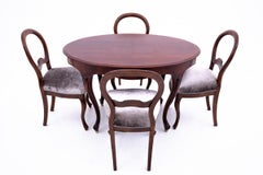 Antique table with chairs, Northern Europe, around 1870.