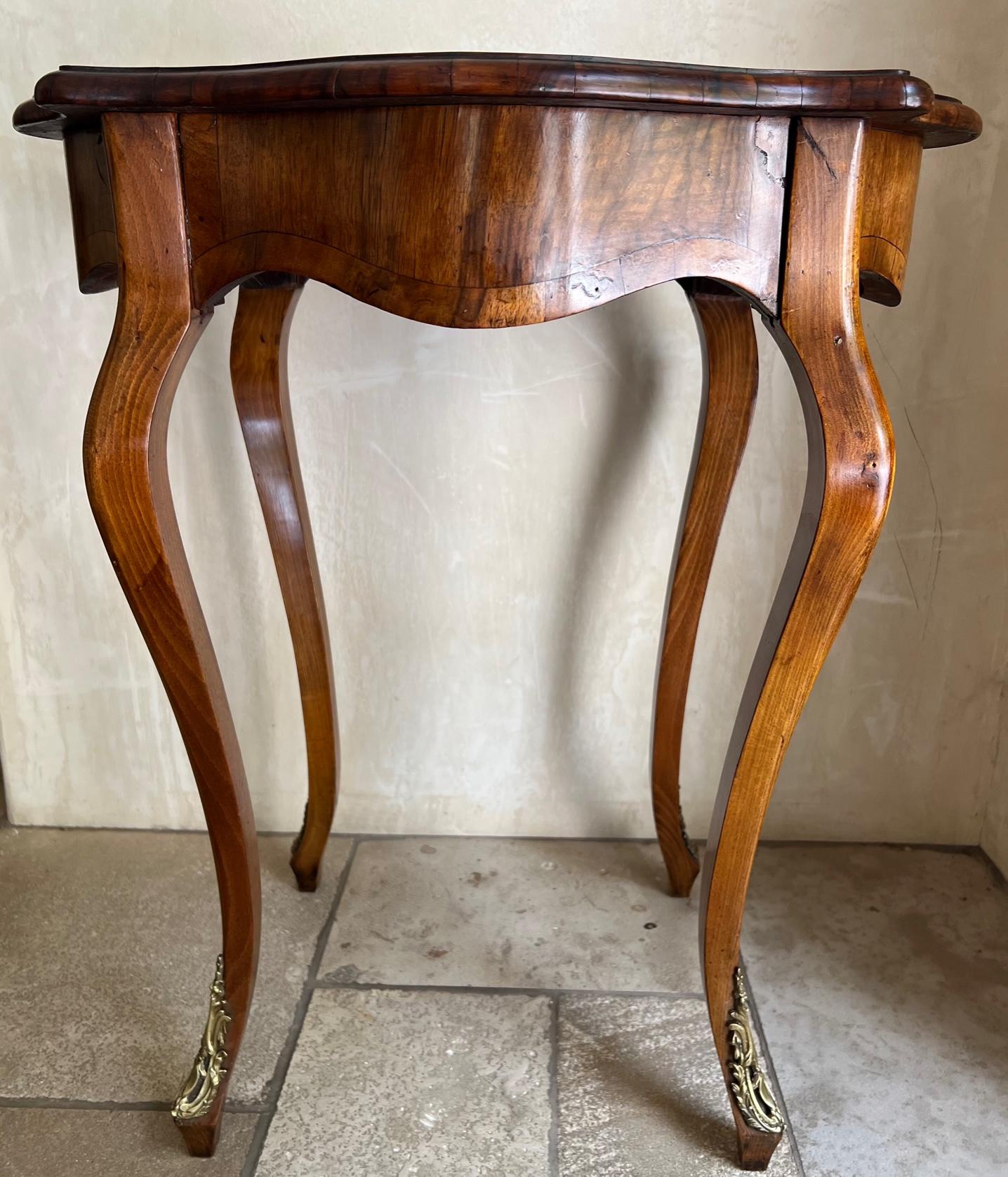 Early 20th Century Antique Table With Inlaid Split Wood Top and Brass Ormolu Detail For Sale