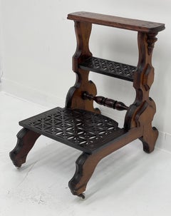 Antique decorative library stepsTable with Metal Accent and Casters.