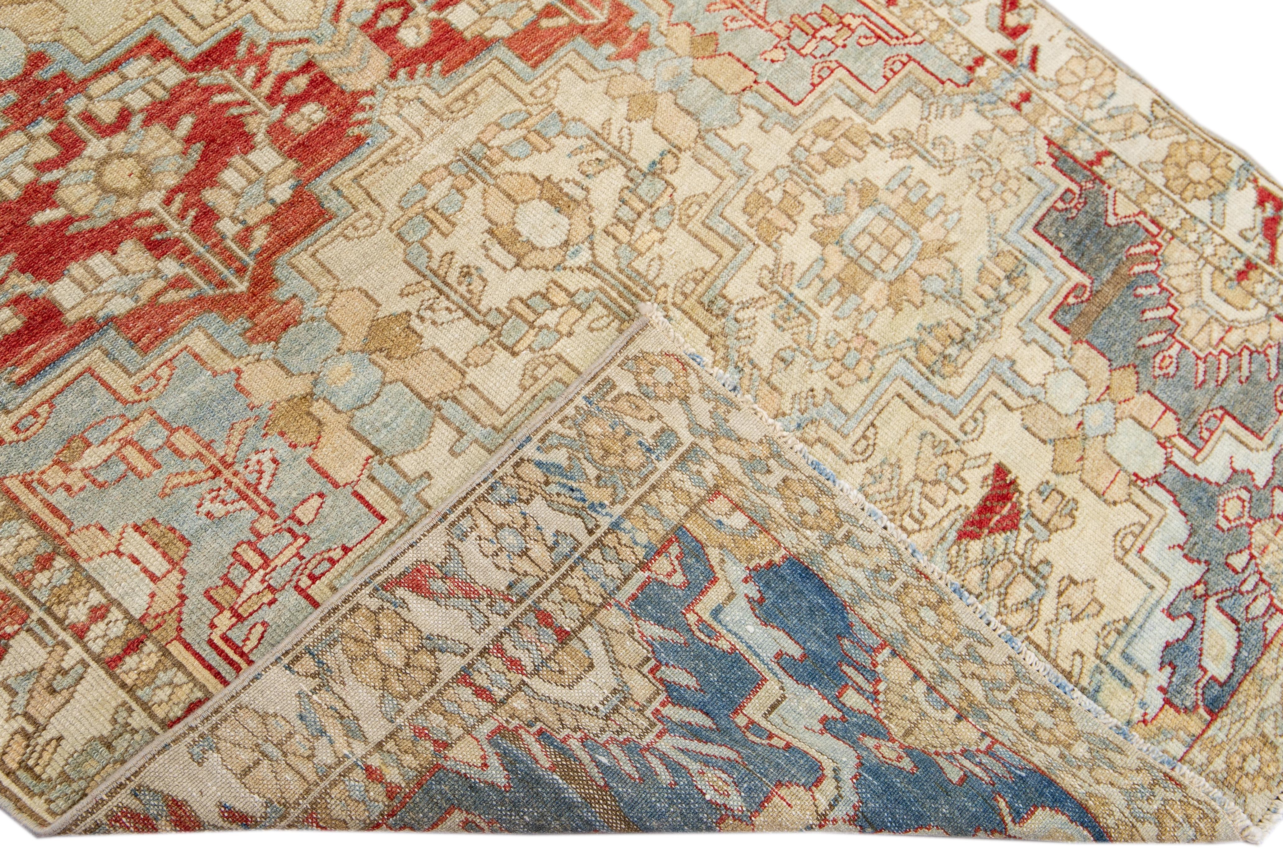 Beautiful antique Tabriz hand-knotted wool rug with a beige field. This piece has a blue and red accent in a gorgeous all-over geometric floral design.

This rug measures: 3'10