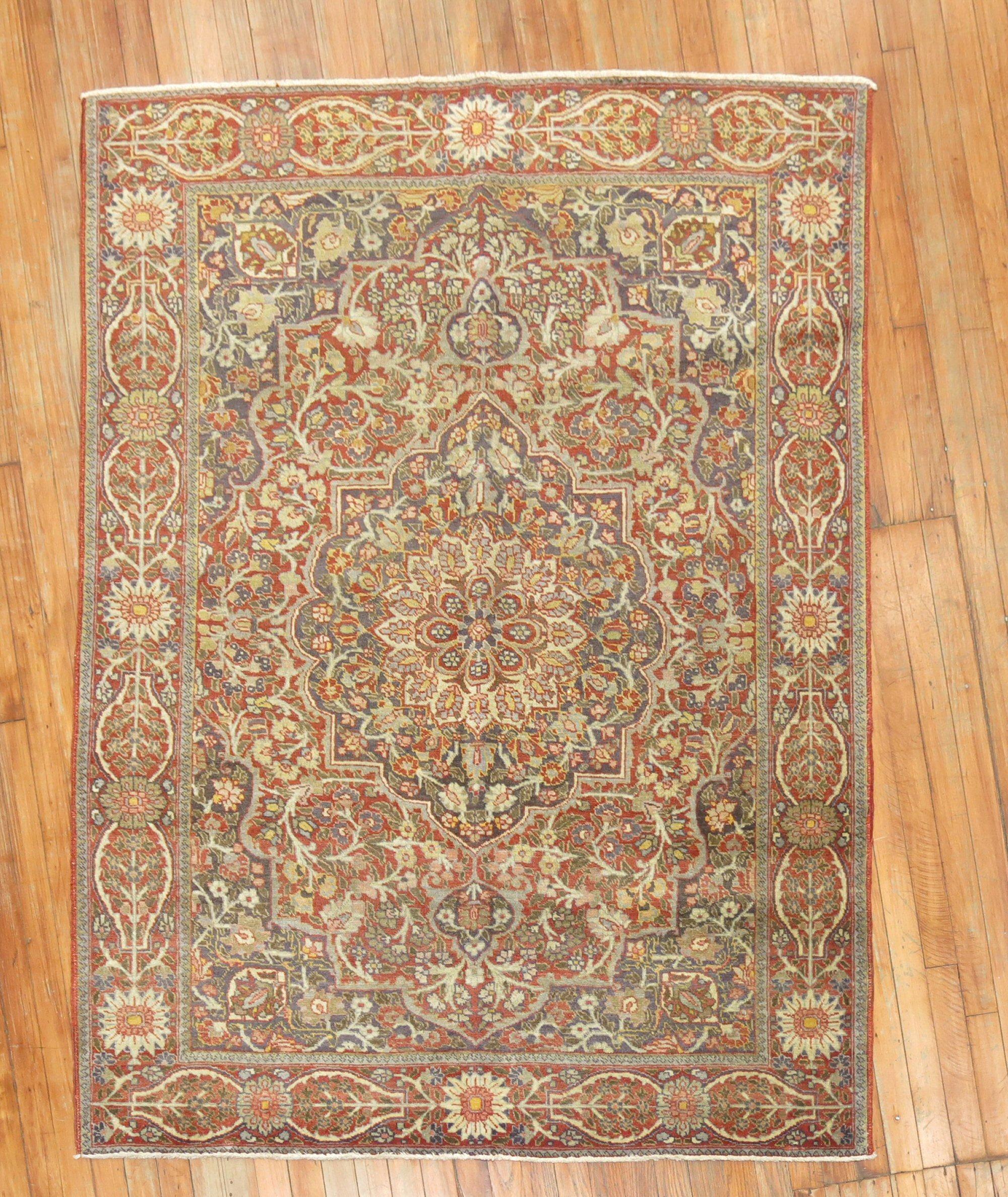1st quarter of the 20th century Persian Tabriz rug with a traditional medallion and border design in autumn colors

Measures: 4'7'' x 6'.