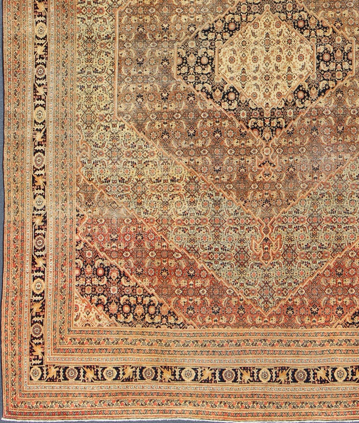 Antique Tabriz Haji-Jalili rug with diamond design rendered in floral motifs. Keivan Woven Arts / rug TU-ALK-4882, country of origin / type: Iran / Tabriz, circa 1880.
Measures: 9'9 x 12'8.
This magnificent antique Persian Tabriz carpet from late