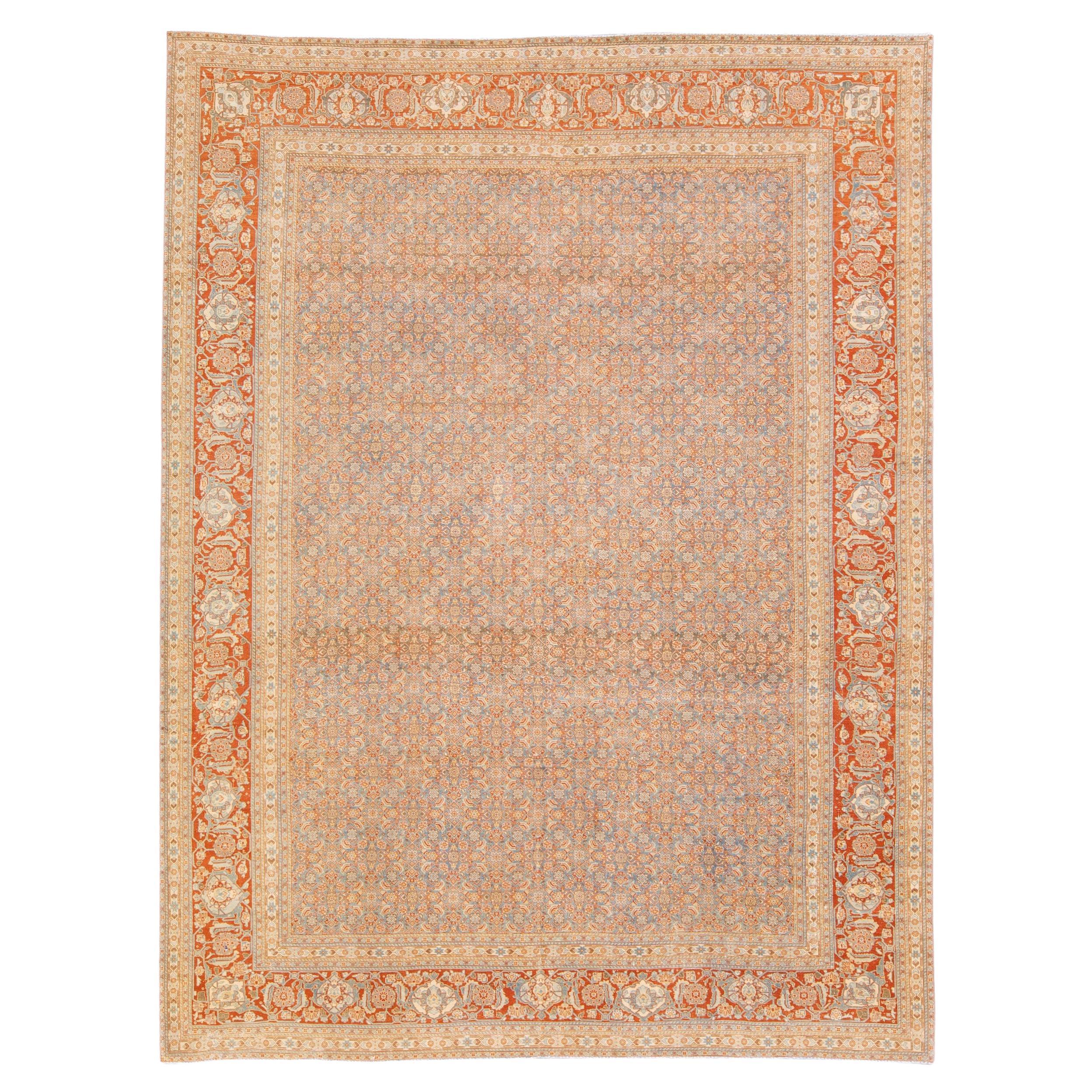 Antiker handgefertigter blauer und rostfarbener persischer Wollteppich in Täbris-Muster