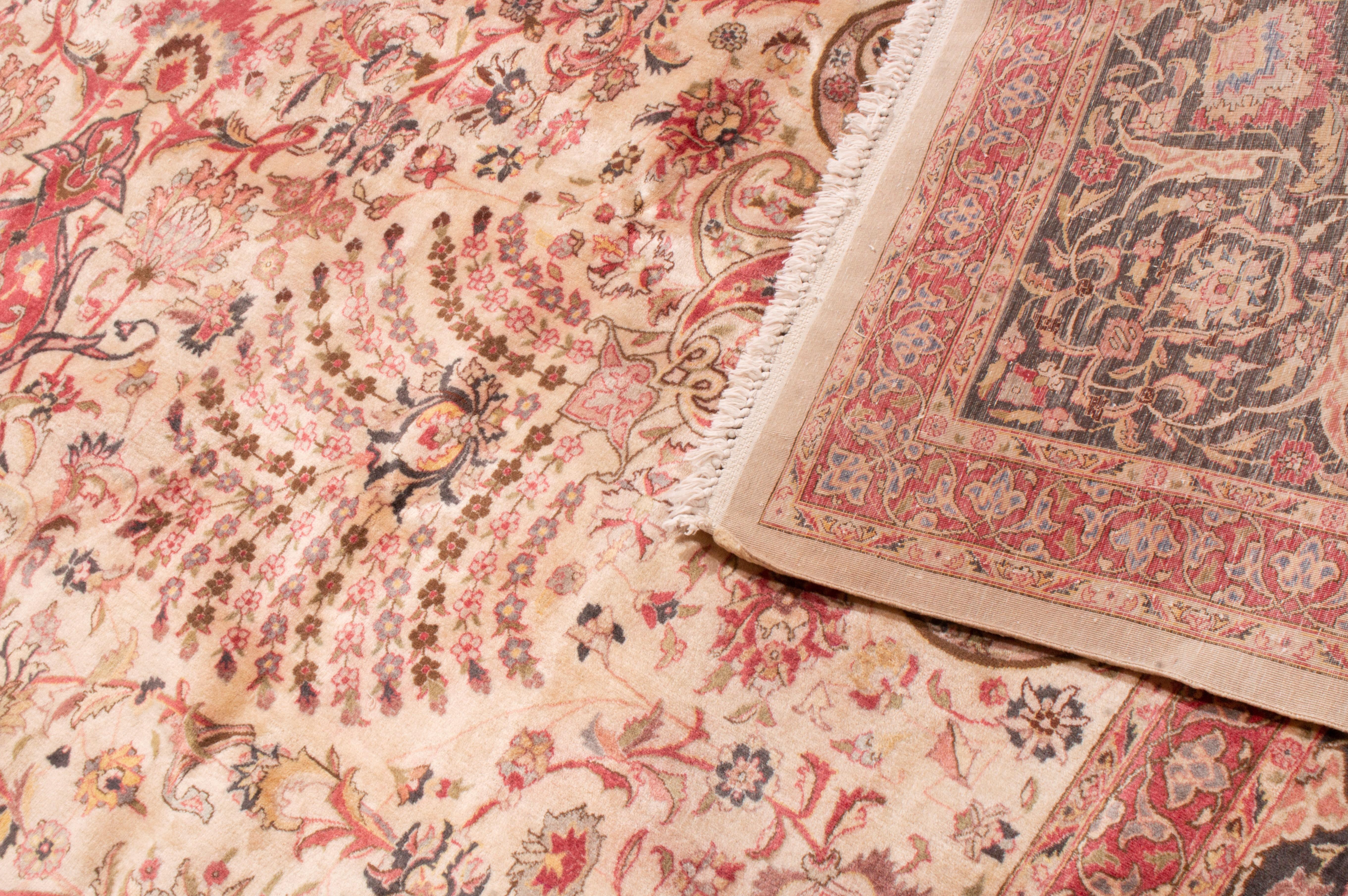 Antique Tabriz Medallion-Style Pink Wool Rug with Floral Patterns In Good Condition For Sale In Long Island City, NY