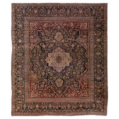 Antiker antiker handgefertigter blauer und roter Medaillon-Oversize-Wollteppich aus Täbris