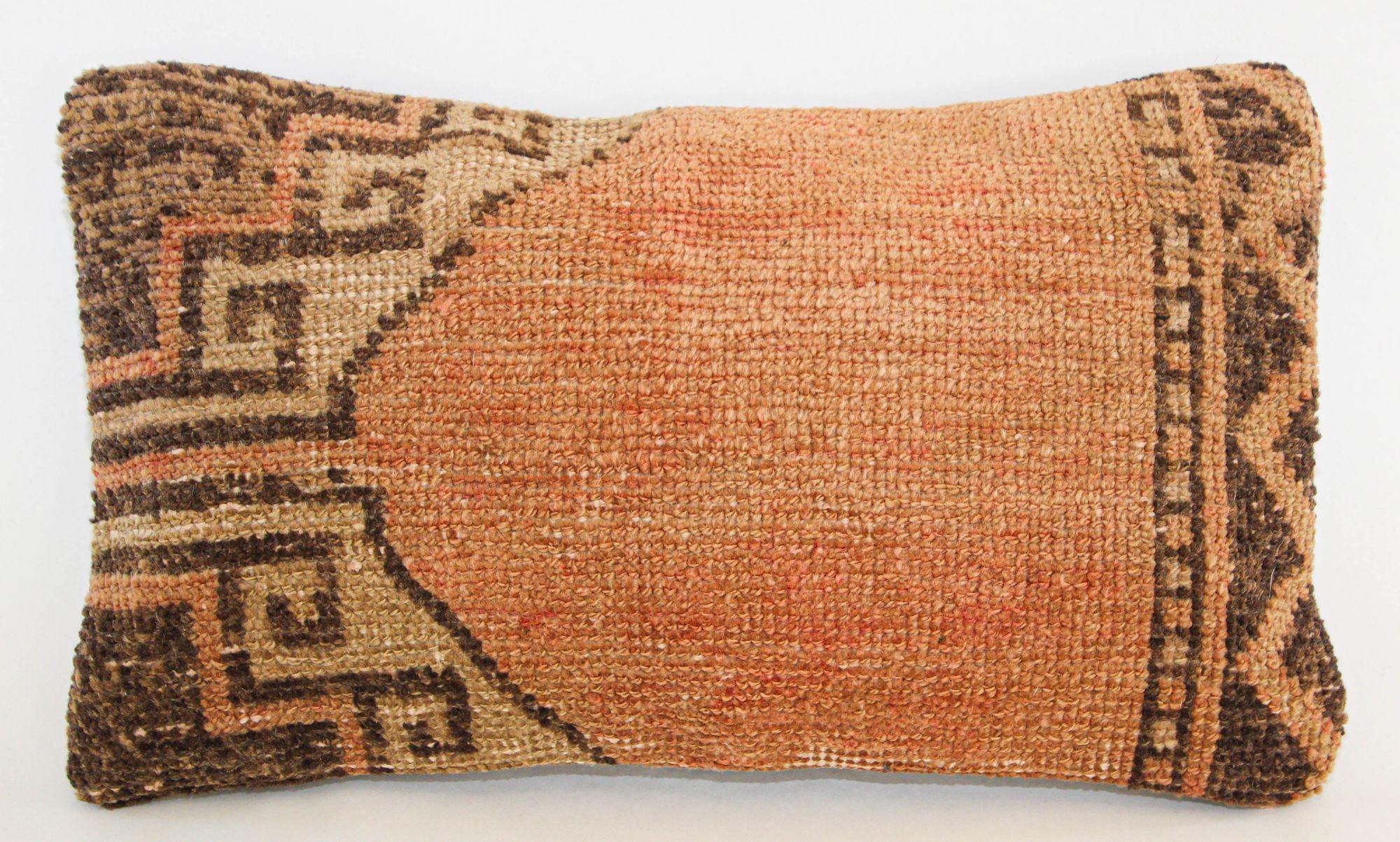 Antique Tabriz Persian rug pillow.
This lumbar pillow was made from an early 20th-century Persian Tabriz rug.
This lovely antique decorative pillow features an antique fragment fabric rug on front which is characterized by geometric abstracts