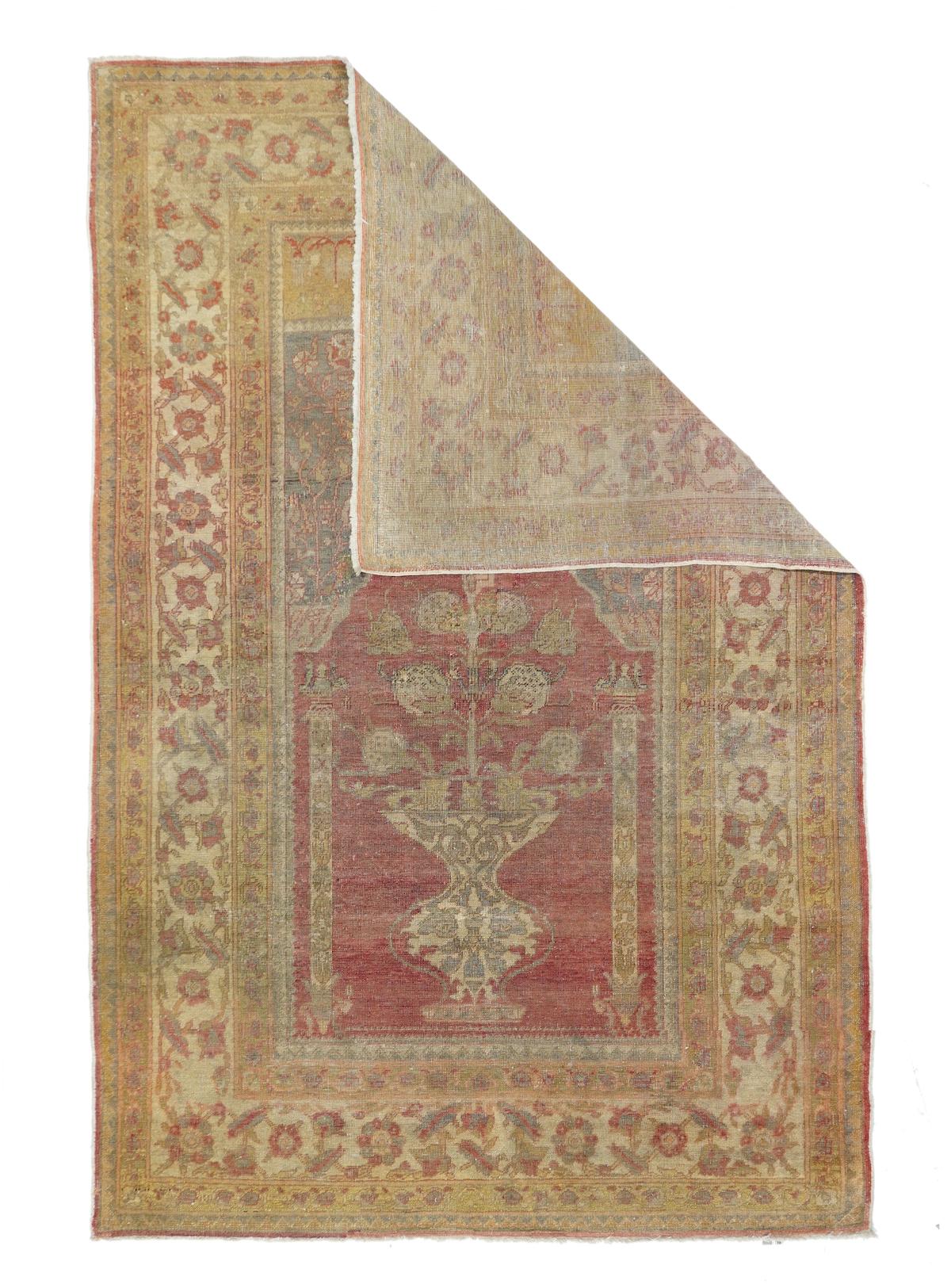 Antique Tabriz rug 4'3'' x 6'4''. Around 1900 there was a vogue in Tabriz for finely woven scatters in Turkish niche designs, often, as here, with red field and semi-functional side columns. A giant vase yields a flowering rose bush, with a wavy