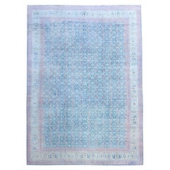 Tapis Tabriz ancien bleu, rouge, jaune et ivoire