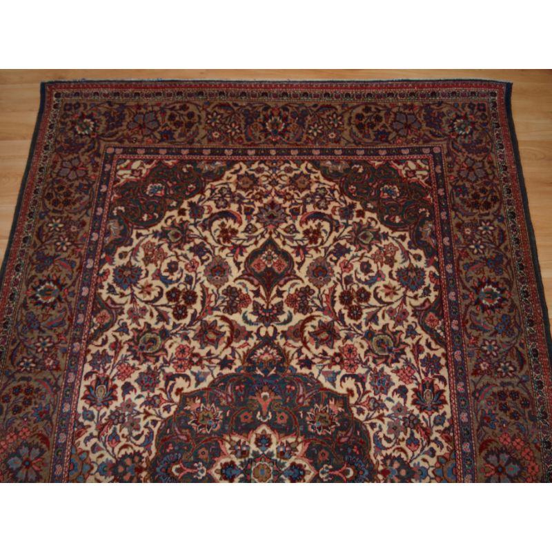 Woven Antique Tabriz Rug of Classic Floral Design with a Central Medallion on a Light  For Sale