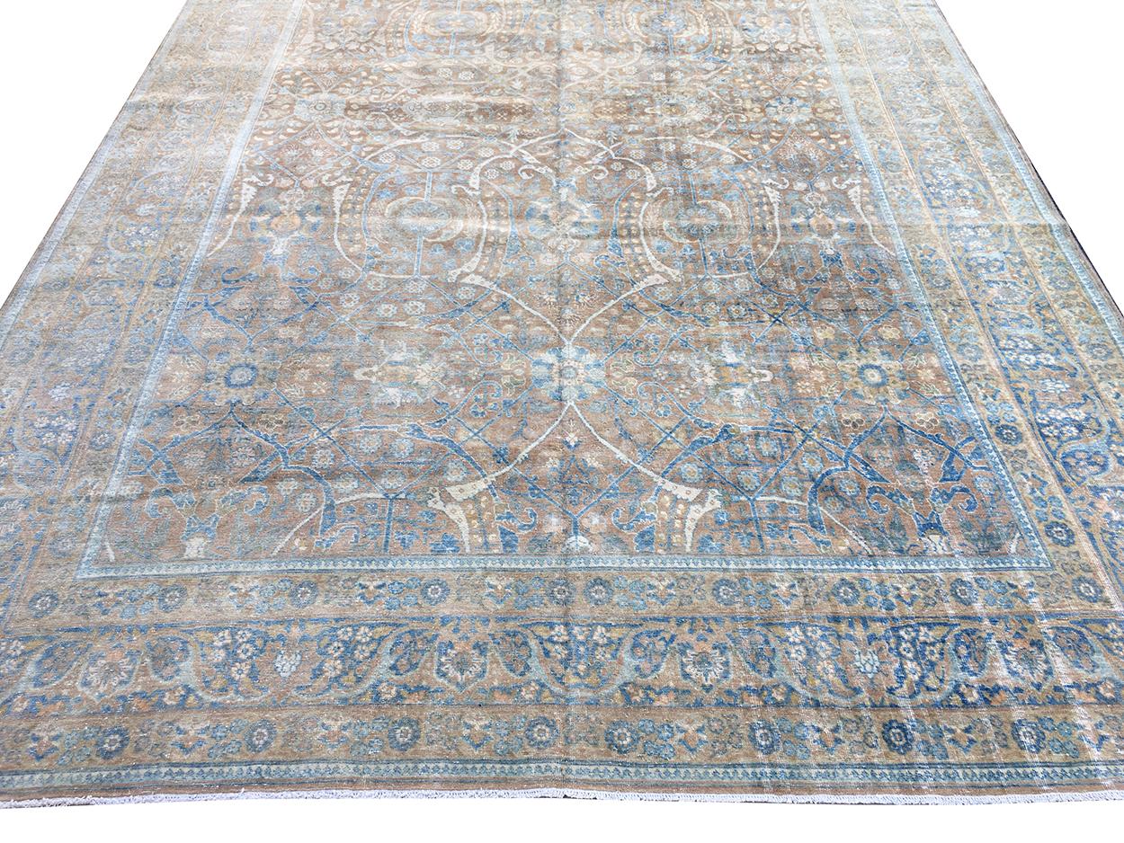 Antique Tabriz Rug 8300, Country of Origin: Persian Rugs, Circa Date: 1900 — This is an incredible piece from one of the most famous rug centers in the world. The carpet uses golden browns, slate blues and ivory blended to create a carpet of