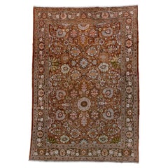 Antique Tabriz Rug with a Warm Red Field and a Rosette Design 