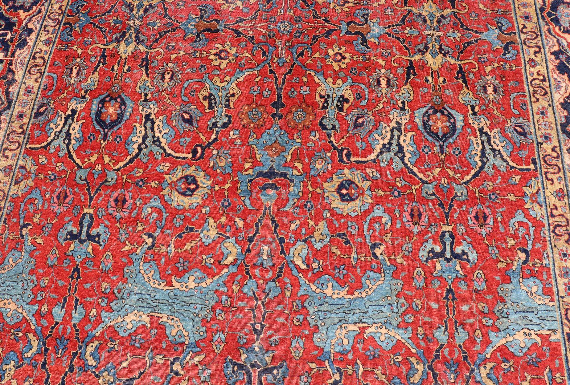 Antique Tabriz Rug with All Over Design in Rust Red, Blue's, Yellow, and L. Blue In Good Condition For Sale In Atlanta, GA