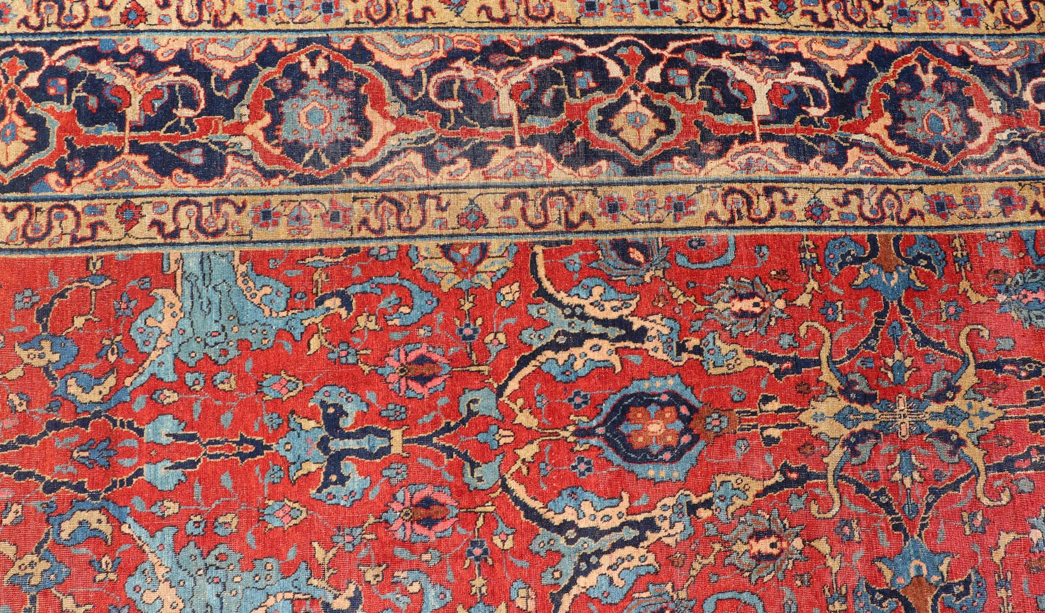 Wool Antique Tabriz Rug with All Over Design in Rust Red, Blue's, Yellow, and L. Blue For Sale