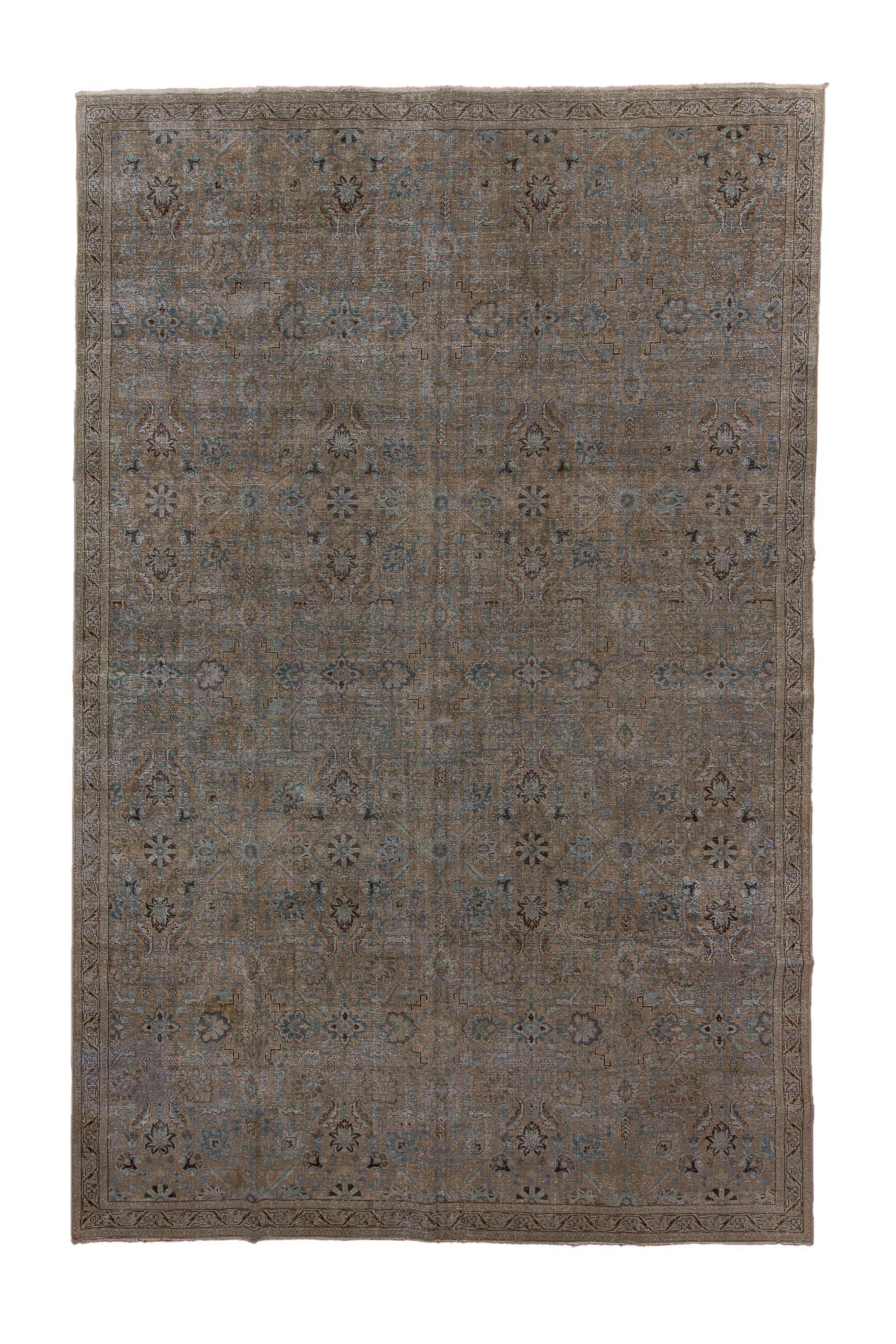 This well-woven urban carpet show a  buff field with a subdued design featuring bitonal daisy rosettes and other small-scale floral elements. Various small petal and  spade palmettes also appear. The borders are narrow, A very discrete carpet.

Rug