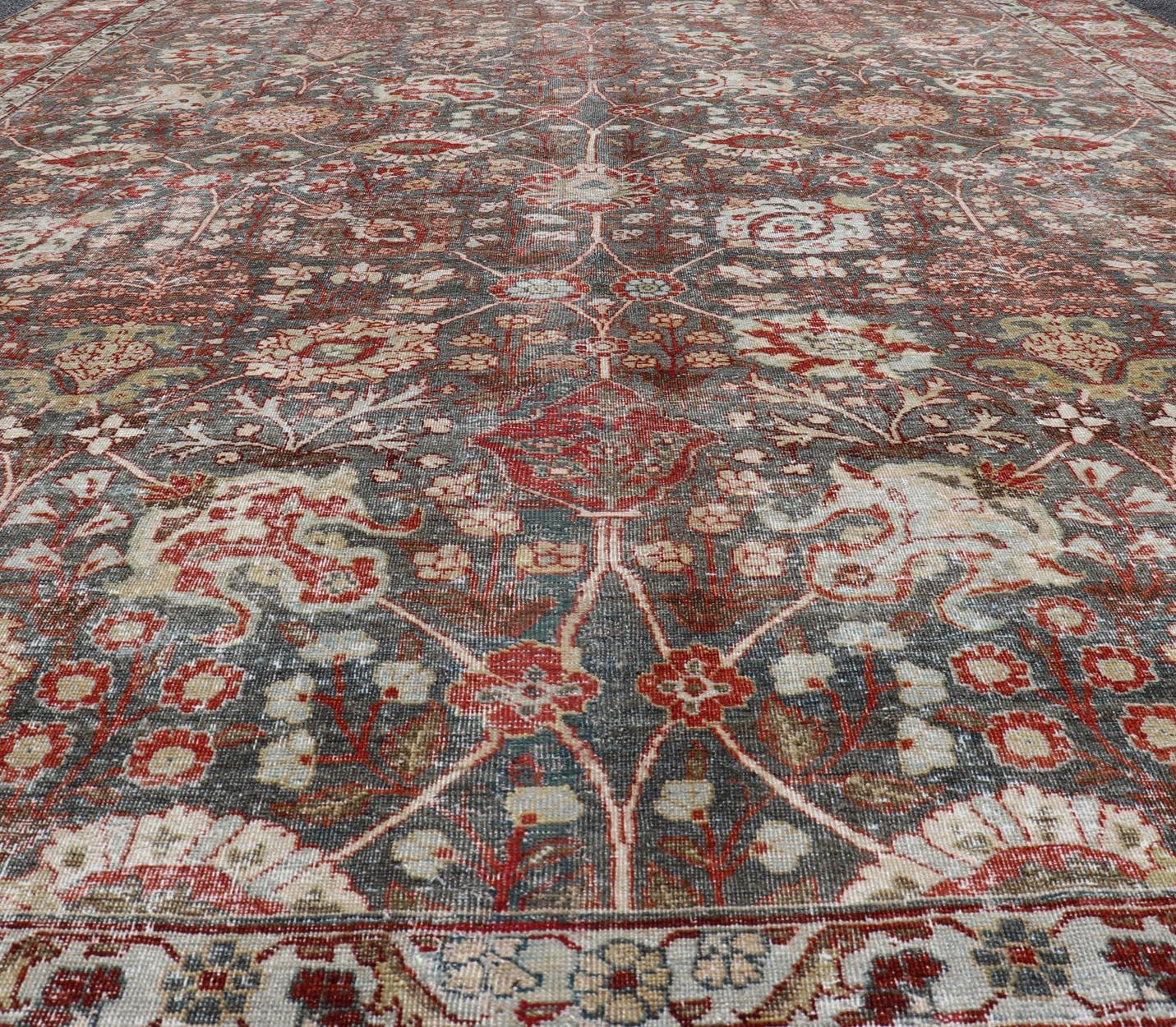 Antique Tabriz with All-Over Floral Sub-Geometric Design In Charcoal and Red. Antique Floral Tabriz, Keivan Woven Arts / rug EMB-22102-15103, country of origin / type: Persian / Tabriz, circa Early-20th Century.
Measures: 8'0 x 11'6
This stunning
