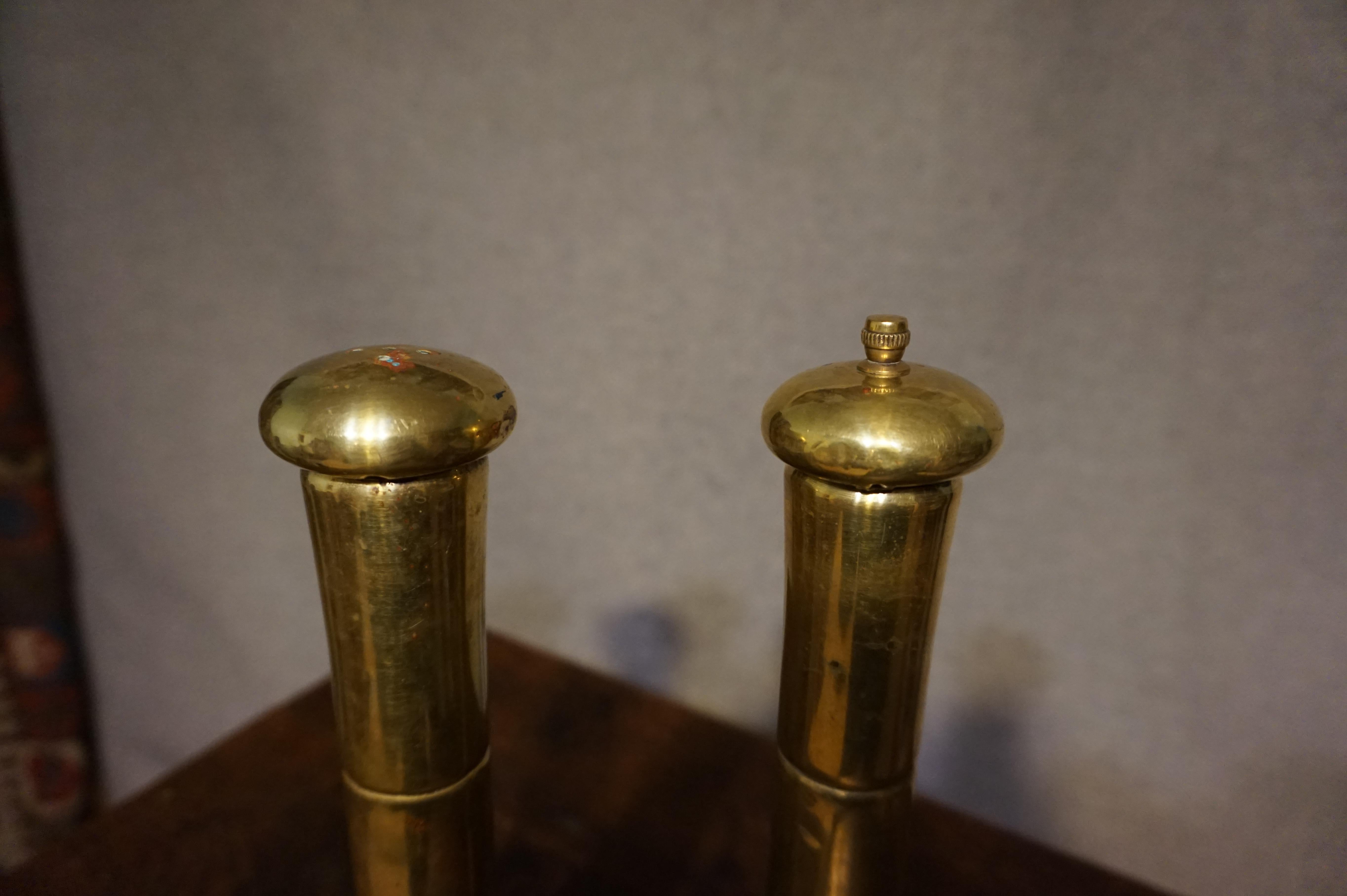Tall brass salt and pepper grinders in good original condition. Unfinished showing age and patina,

circa 1920s