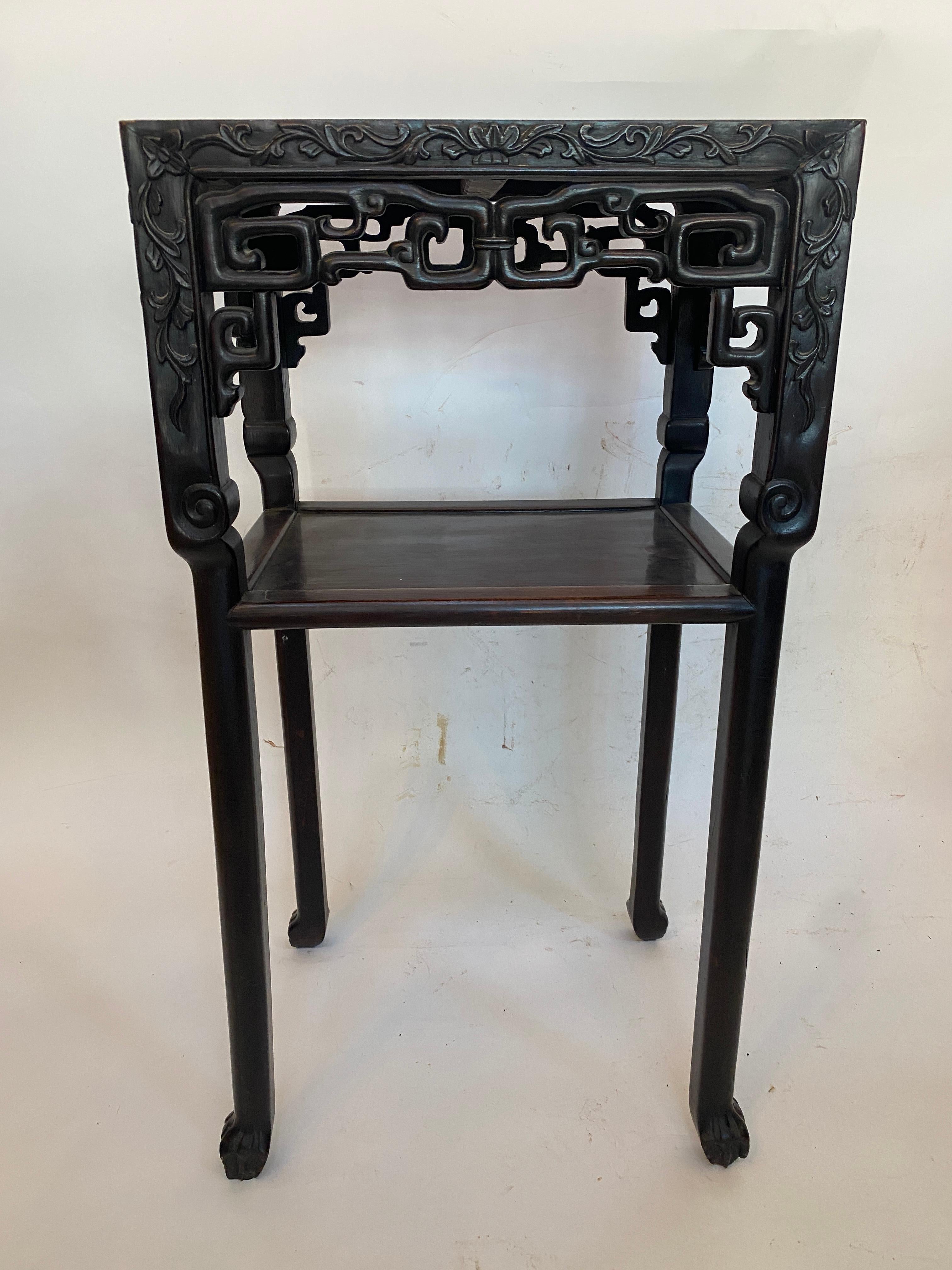 A 19th century antique Chinese carved rosewood two tiered flower stand table with rouge griotte marble top insert, the inset marble top over carved hardwood apron 4 legs, carved with fretwork sides rising on claw feet see more pictures, measures: