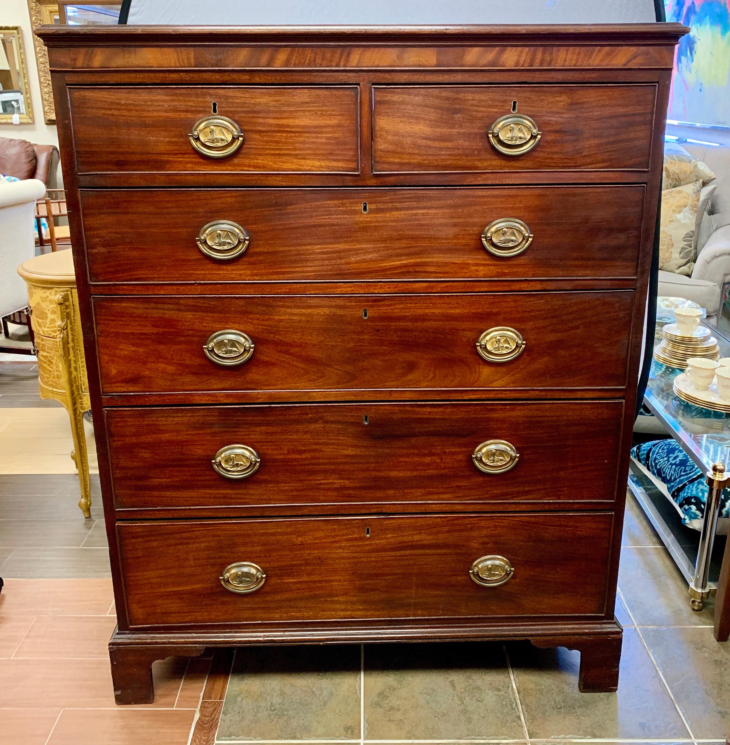 From the 18th century comes this handsome mahogany with two over four drawers with brass oval plate handles with sphinxes. It has mounded edges and stands on bracket feet. The wood has a lovely aged patina only acquired through its age and use.