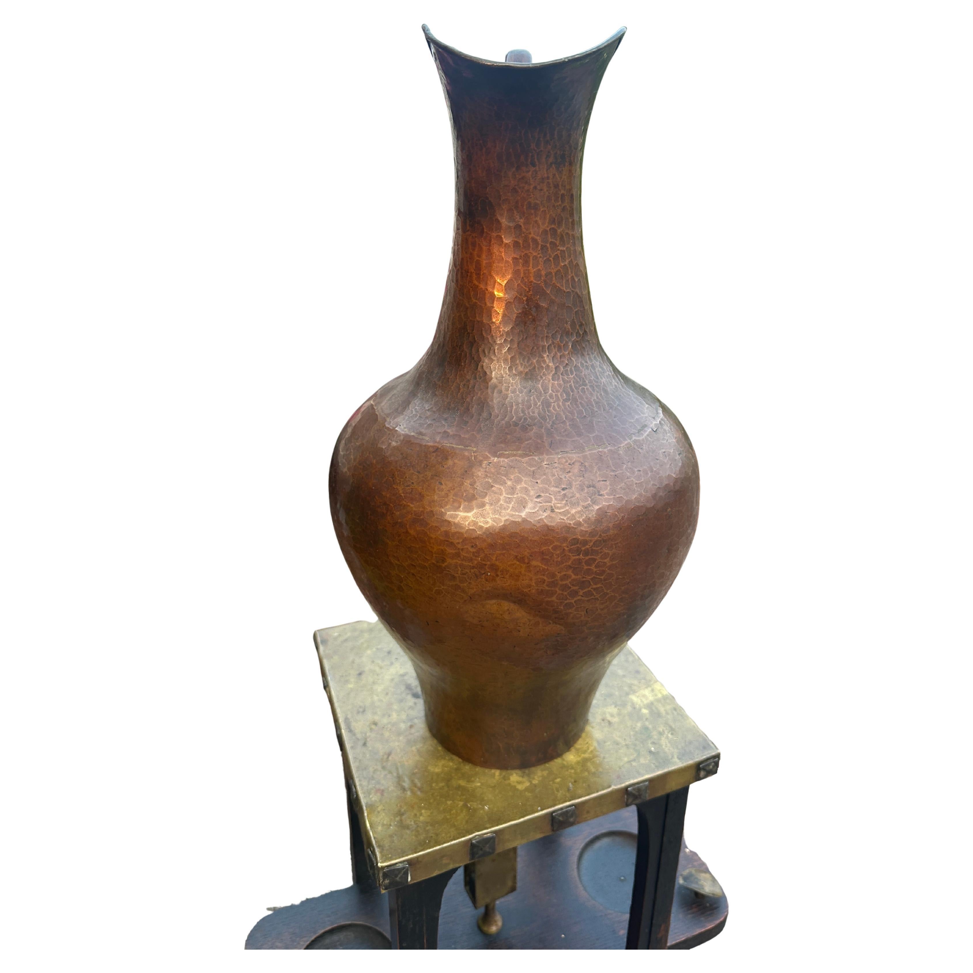 Antique Tall Hammered Copper Pitcher - W7591

This is an antique pitcher made from hammered copper. There are two shallow dents, as shown in photos. 