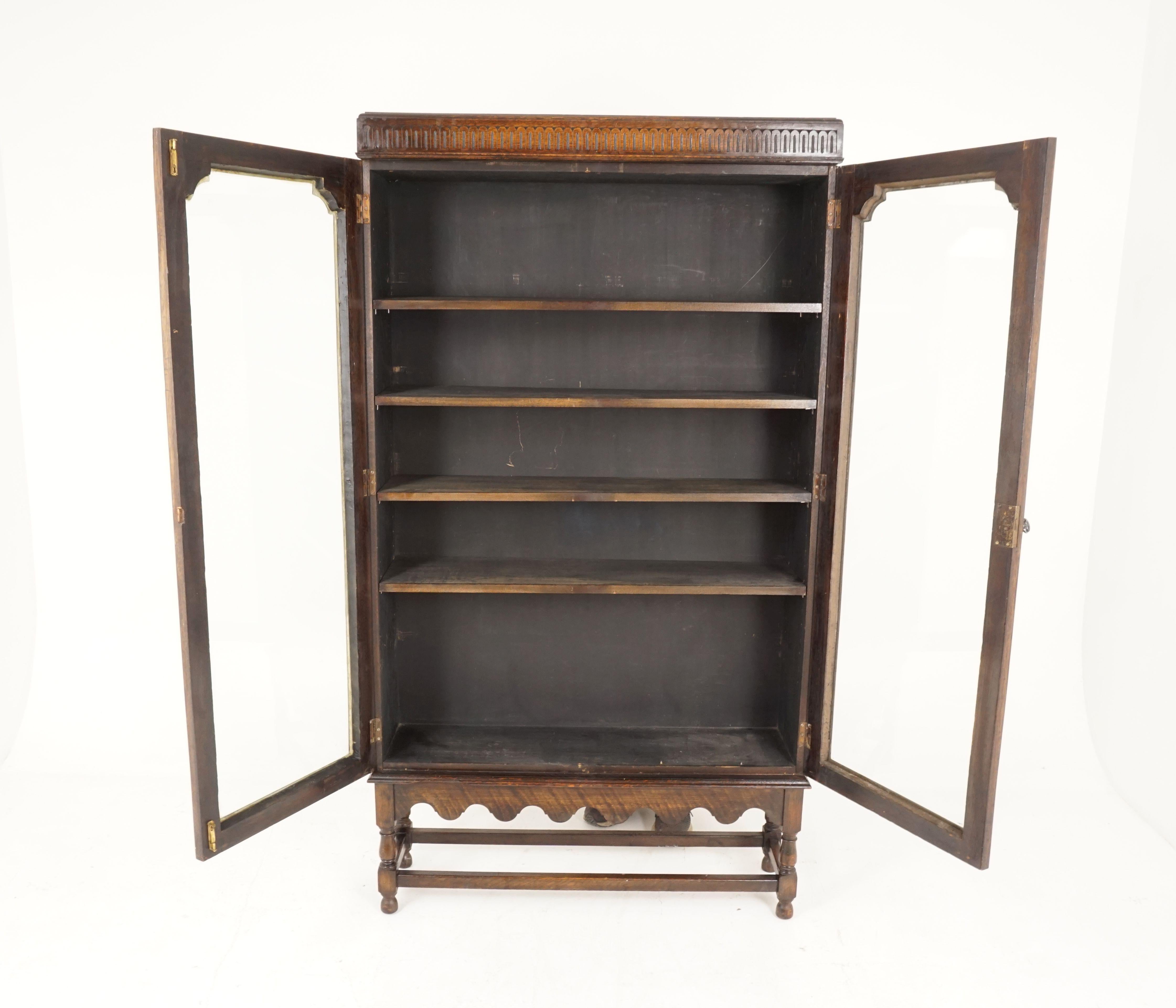 Antique tall oak 2-door cabinet bookcase display cabinet, Scotland 1920, B2220

Scotland 1920
Solid oak
Original finish
Carved cornice on top
Pair of original shaped glass doors
Beading around the doors
Enclosed with four wooden adjustable