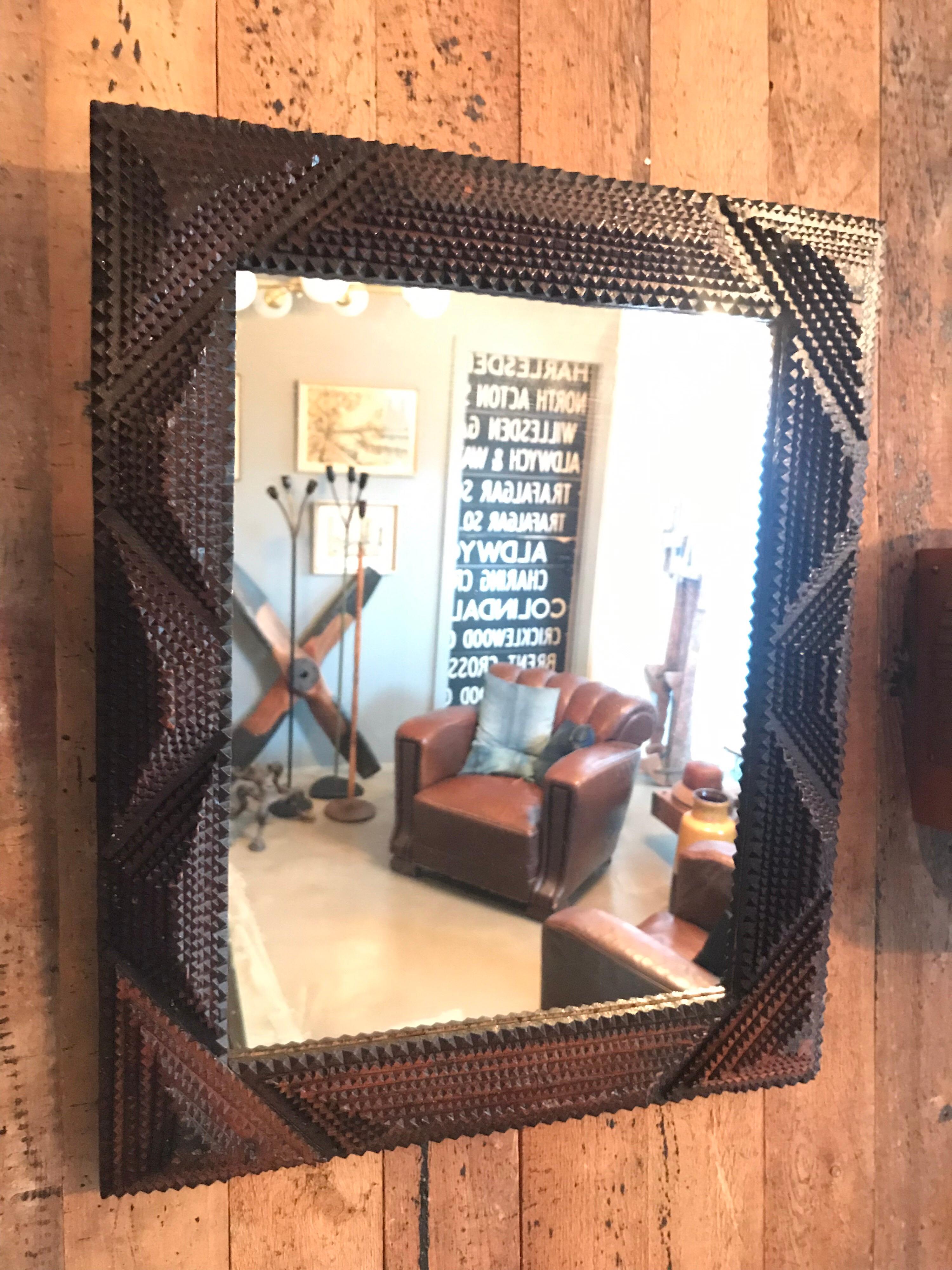 Tramp art mirror from the early 1900s 
Made from cigar boxes
Great attention to detail 
In lovely original condition.